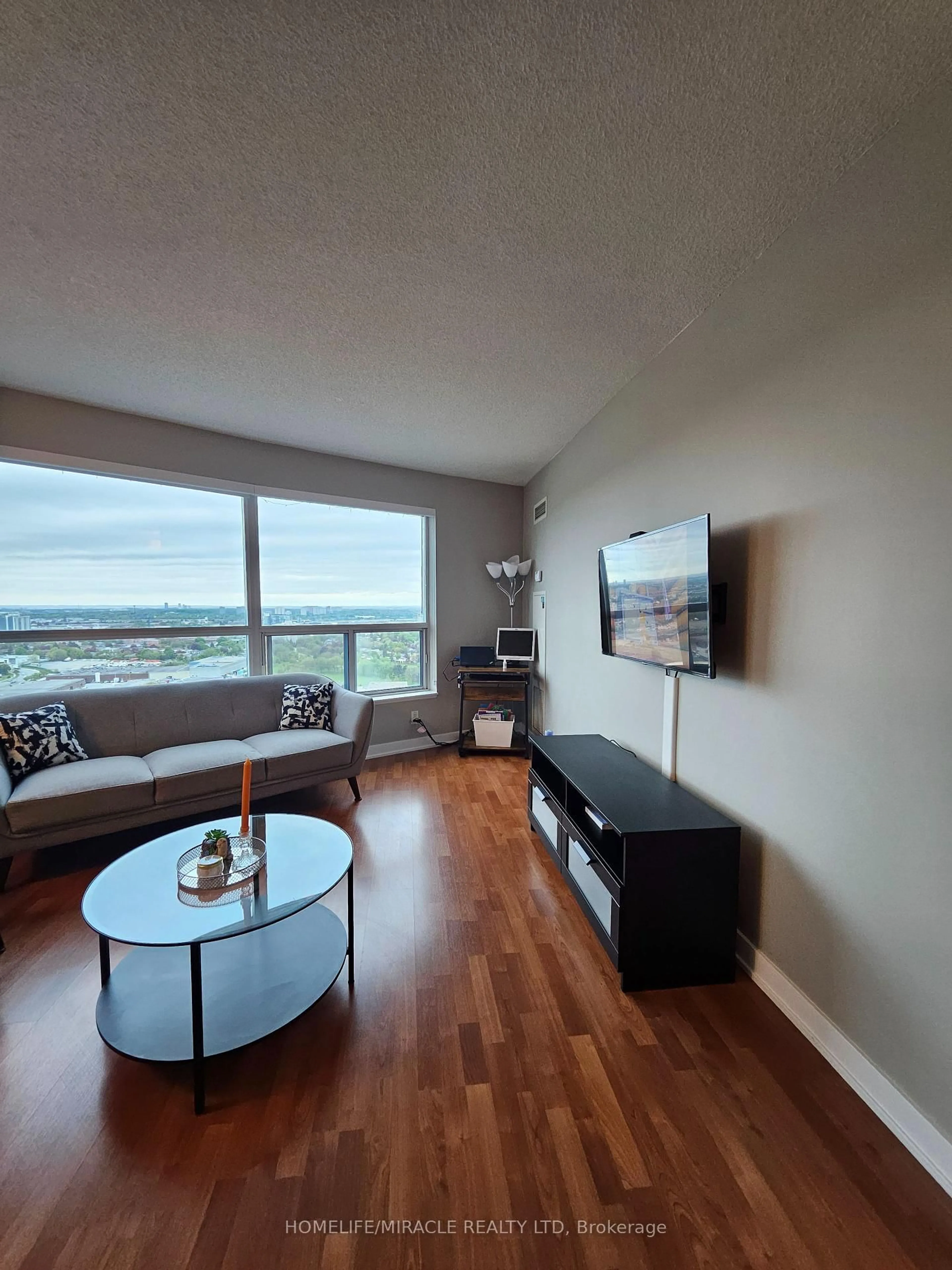 Living room with furniture, wood/laminate floor for 36 Lee Centre Dr #3011, Toronto Ontario M1H 3K2