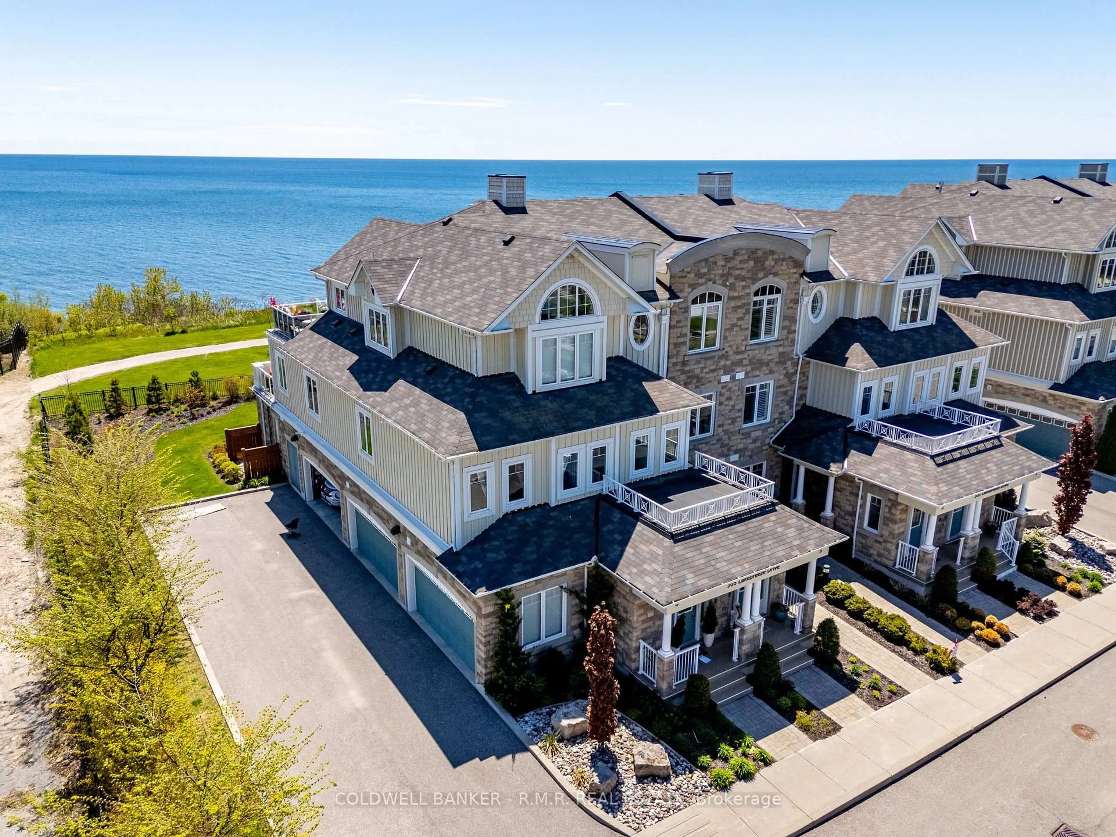 A pic from outside/outdoor area/front of a property/back of a property/a pic from drone, water/lake/river/ocean view for 305 Lakebreeze Dr #6G, Clarington Ontario L1B 0A1