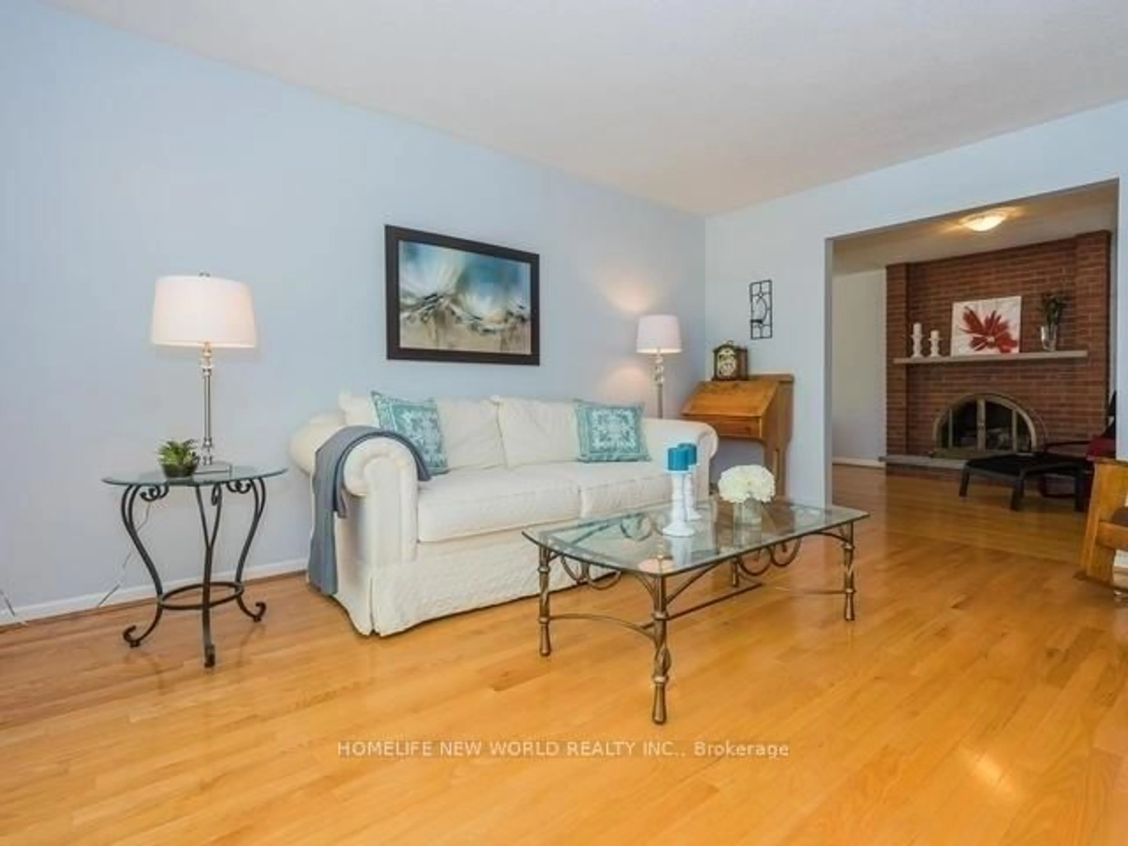 Living room with furniture, wood/laminate floor for 19 Inverary Cres, Toronto Ontario M1T 2W6