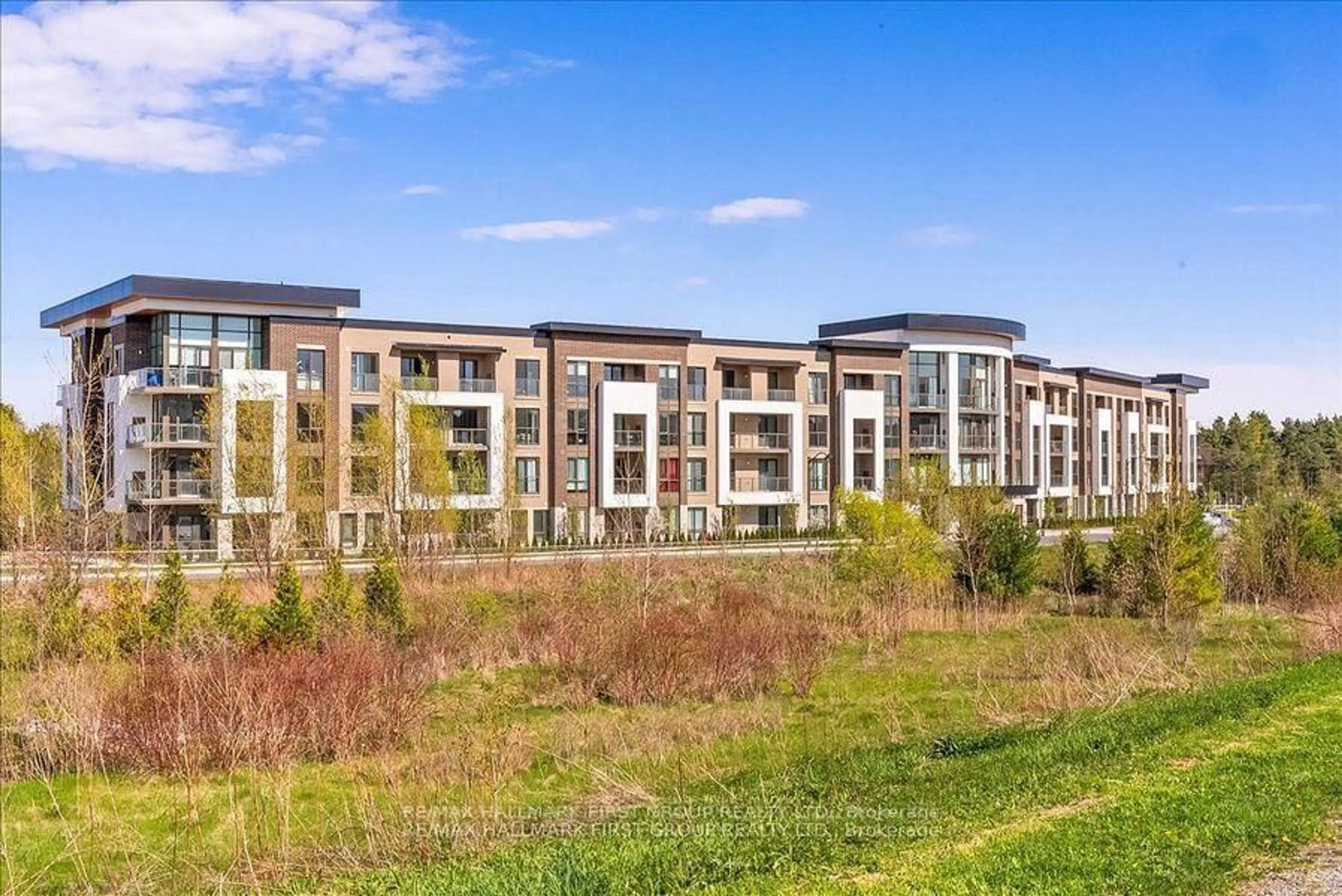 A pic from outside/outdoor area/front of a property/back of a property/a pic from drone, water/lake/river/ocean view for 385 Arctic Red Dr #409, Oshawa Ontario L1L 0W9