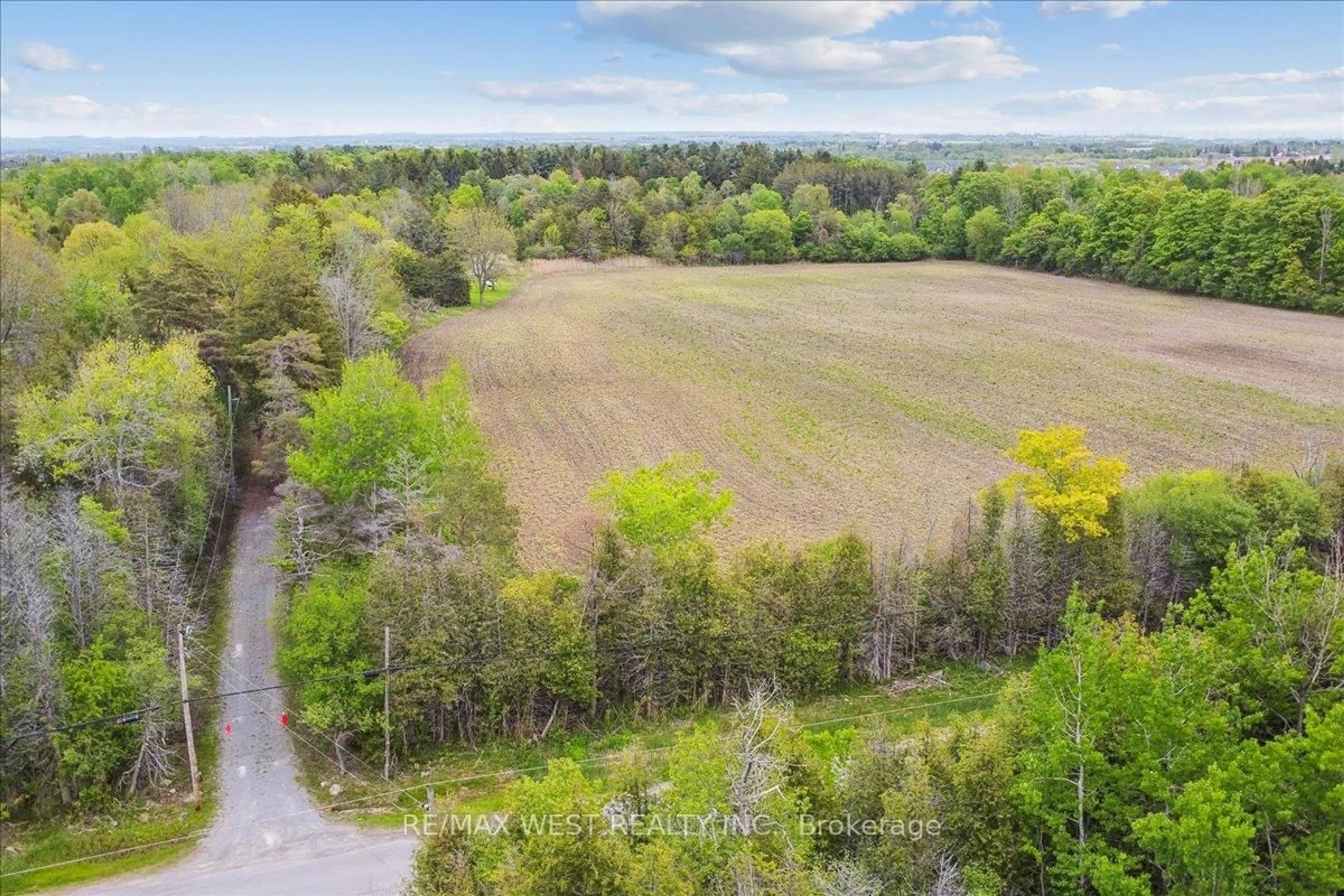 A pic from outside/outdoor area/front of a property/back of a property/a pic from drone, forest/trees view for 2495 Maple Grove Rd, Clarington Ontario L1C 6N1