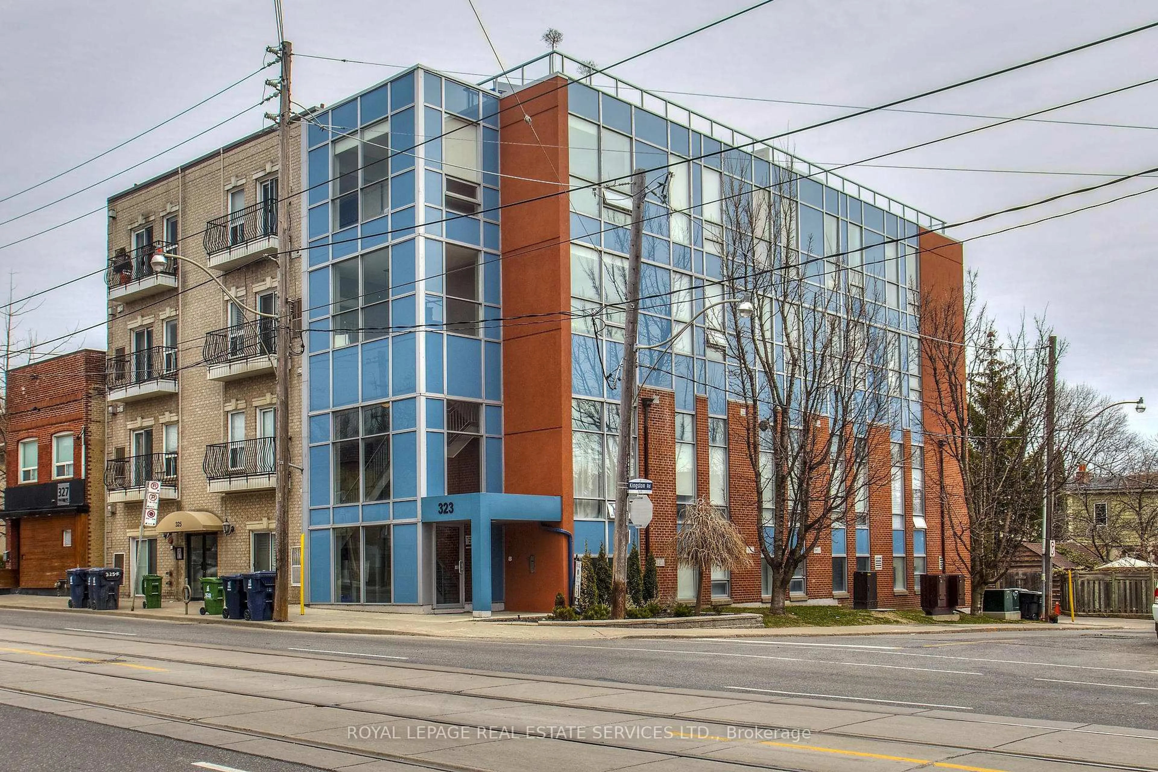 Home with brick exterior material, building for 323 Kingston Rd #203, Toronto Ontario M4L 1T8