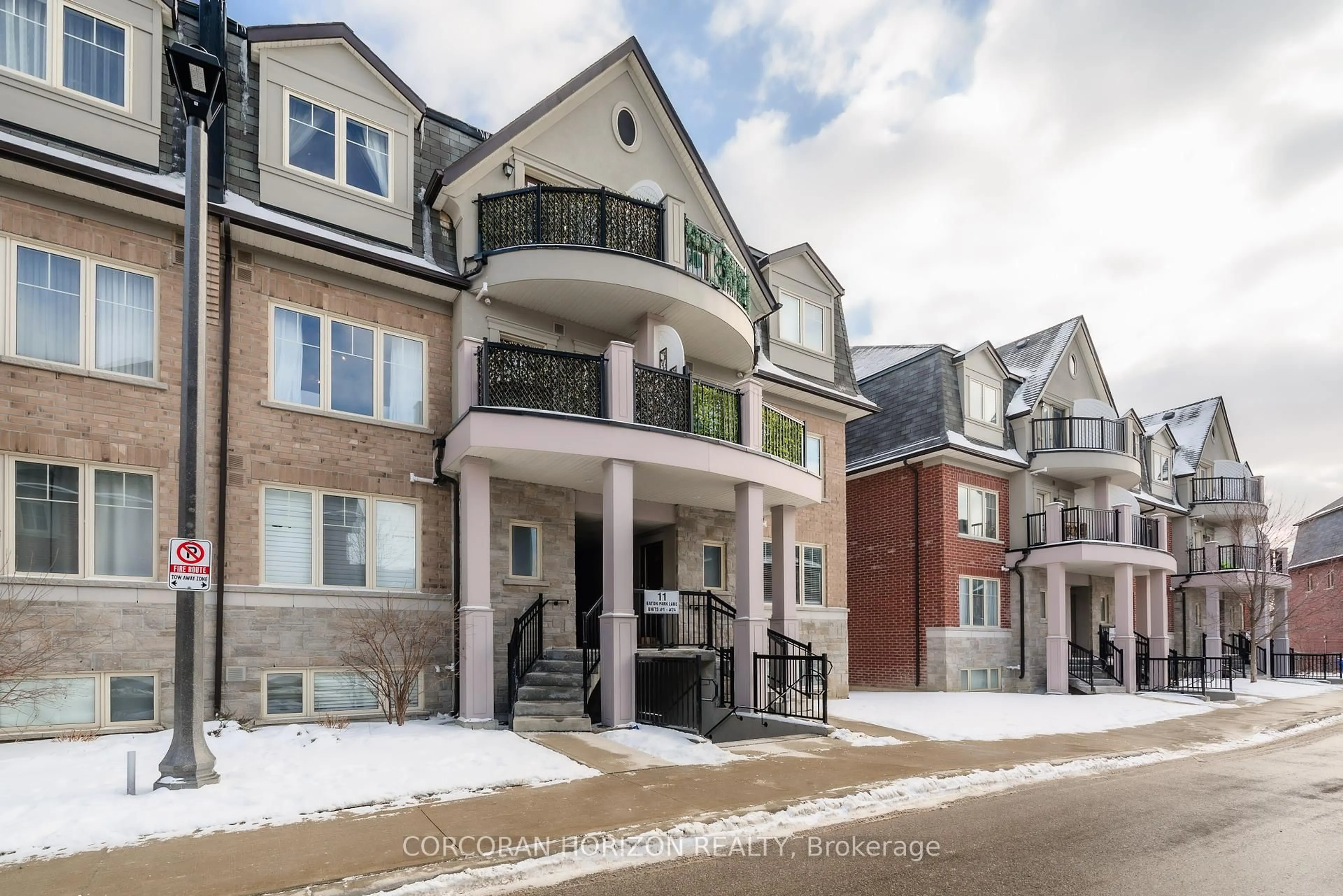 Home with brick exterior material, street for 11 Eaton Park Lane #19, Toronto Ontario M1W 0A5