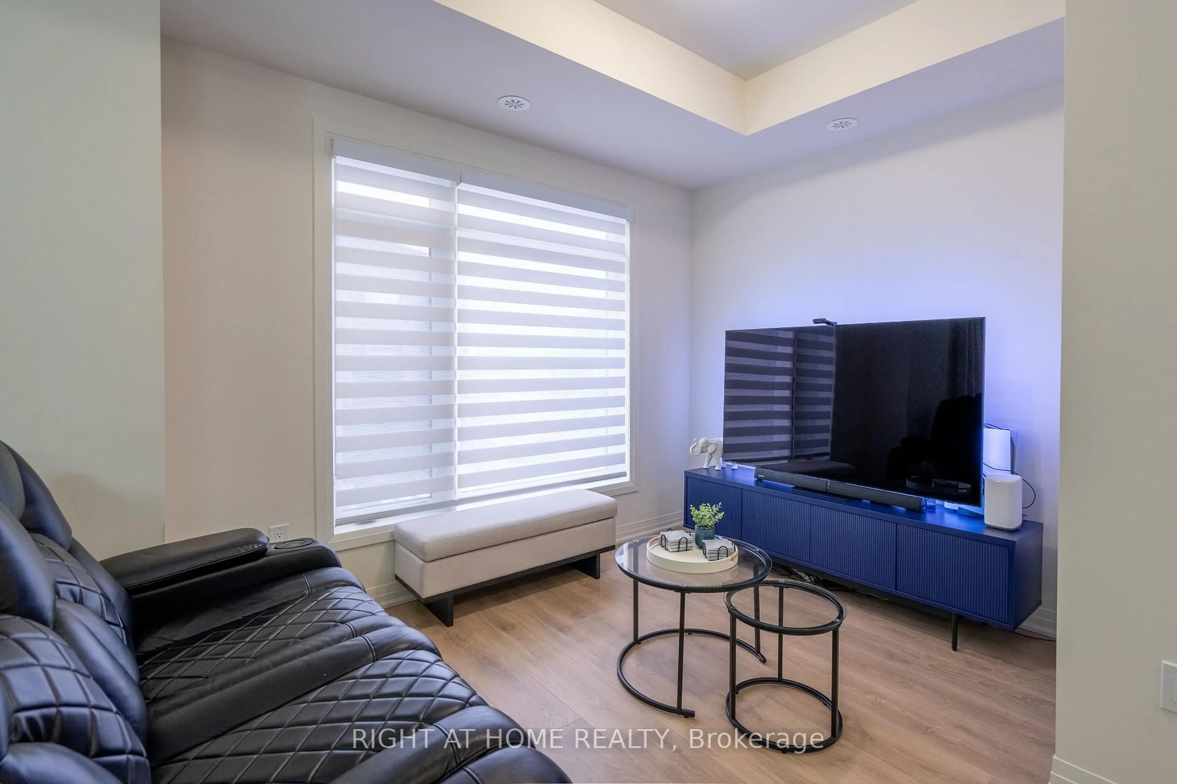 Living room with furniture, wood/laminate floor for 12 Emmas Way, Whitby Ontario L1R 0S7