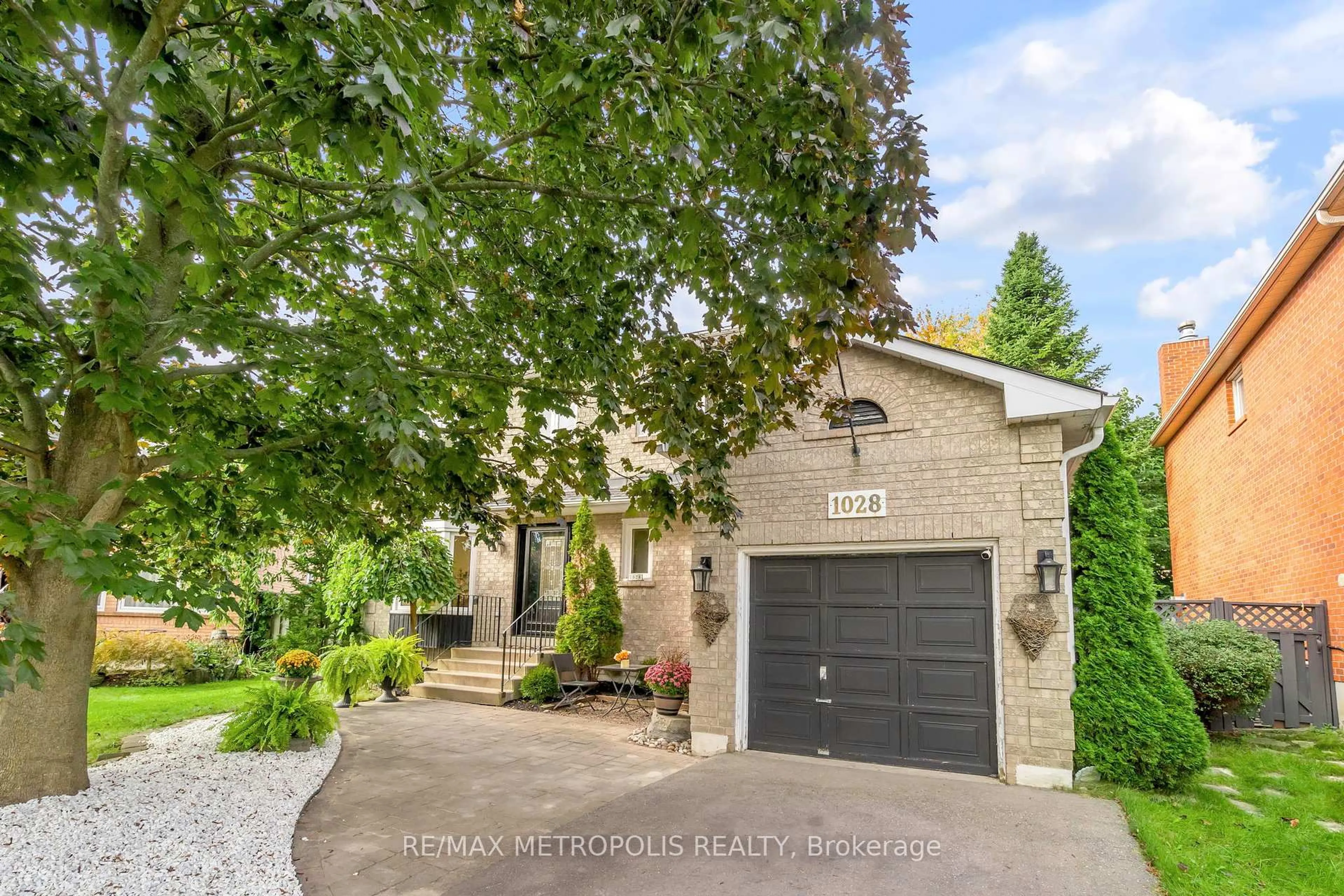 Home with brick exterior material, street for 1028 Moorelands Cres, Pickering Ontario L1W 3K4