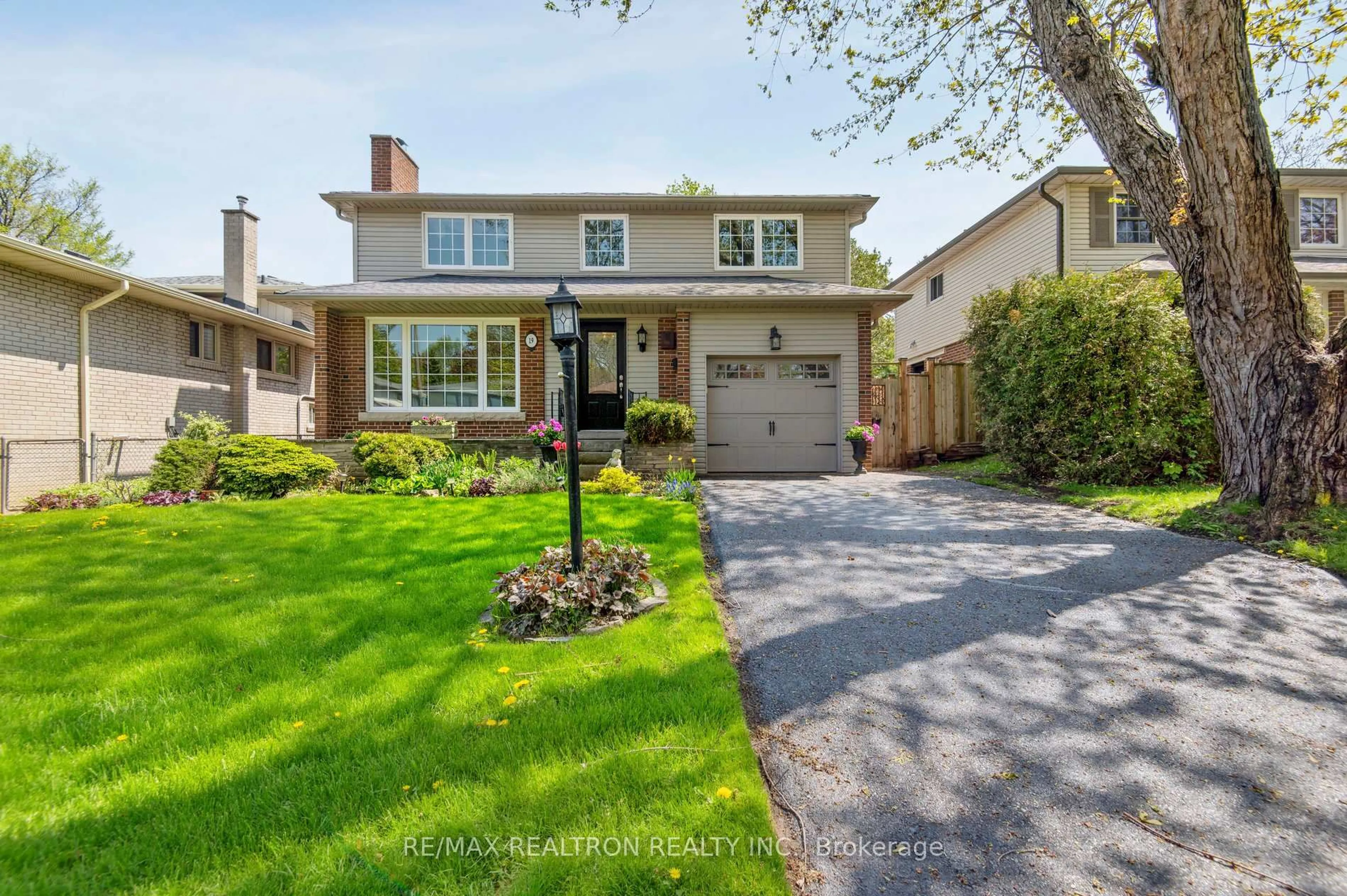 Home with brick exterior material, street for 19 Cathedral Bluffs Dr, Toronto Ontario M1M 2T6