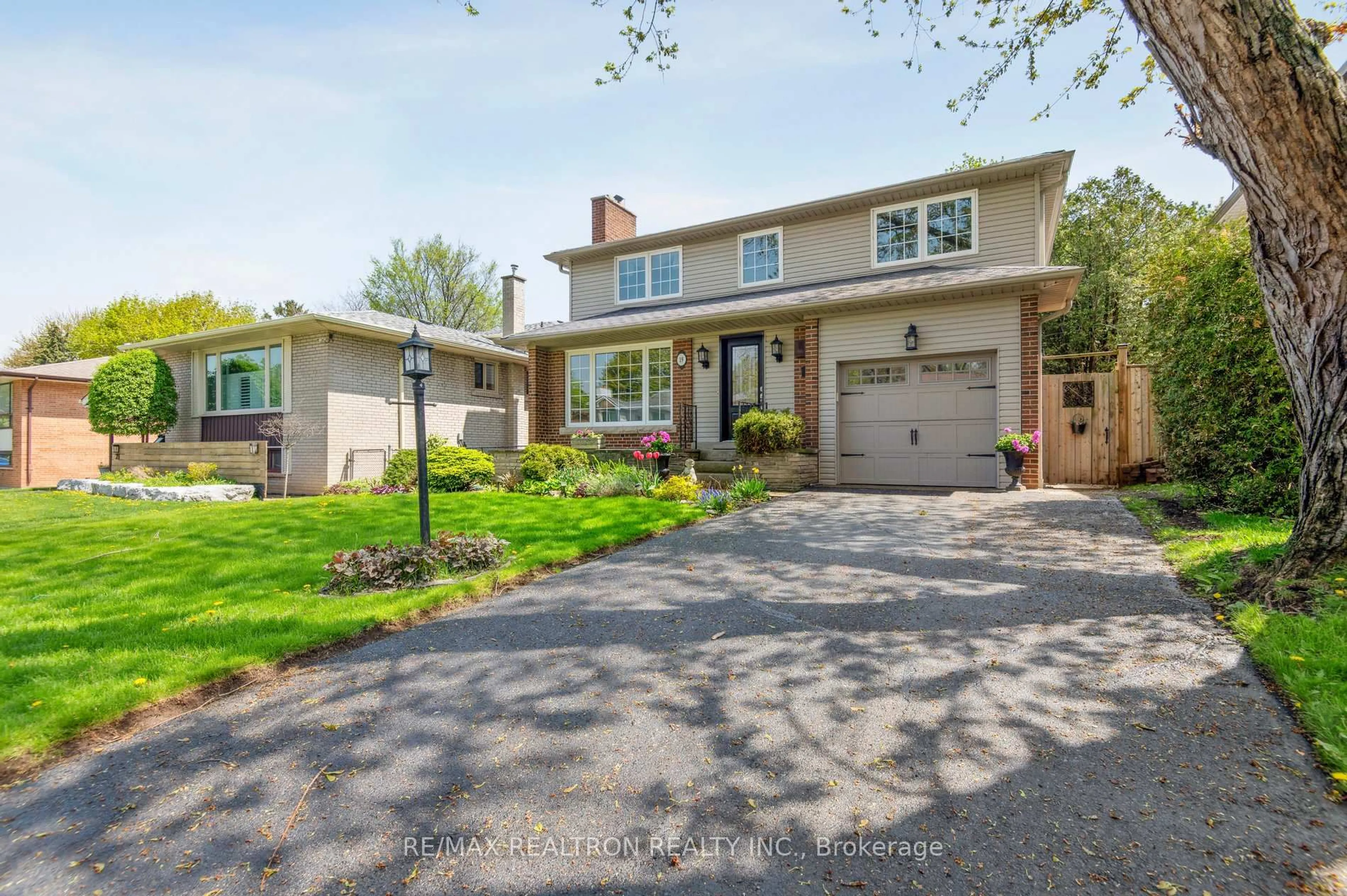 Home with brick exterior material, street for 19 Cathedral Bluffs Dr, Toronto Ontario M1M 2T6
