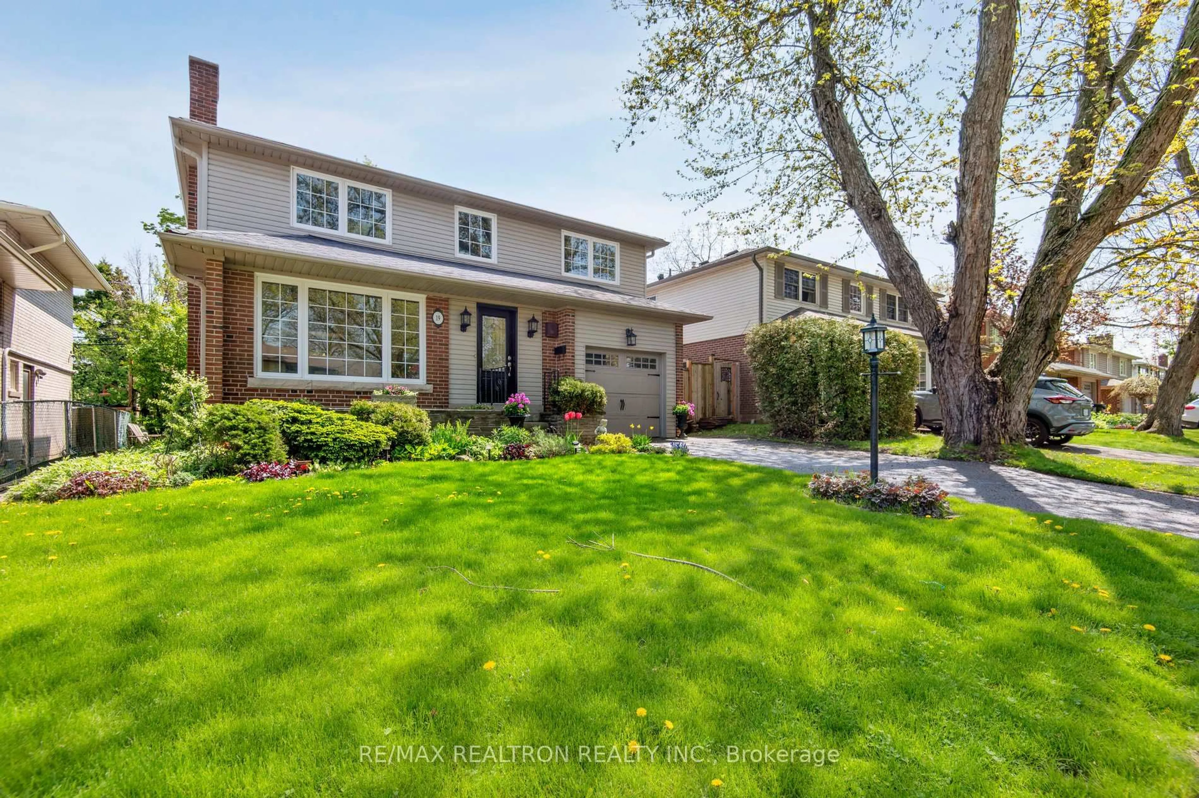 Home with brick exterior material, street for 19 Cathedral Bluffs Dr, Toronto Ontario M1M 2T6
