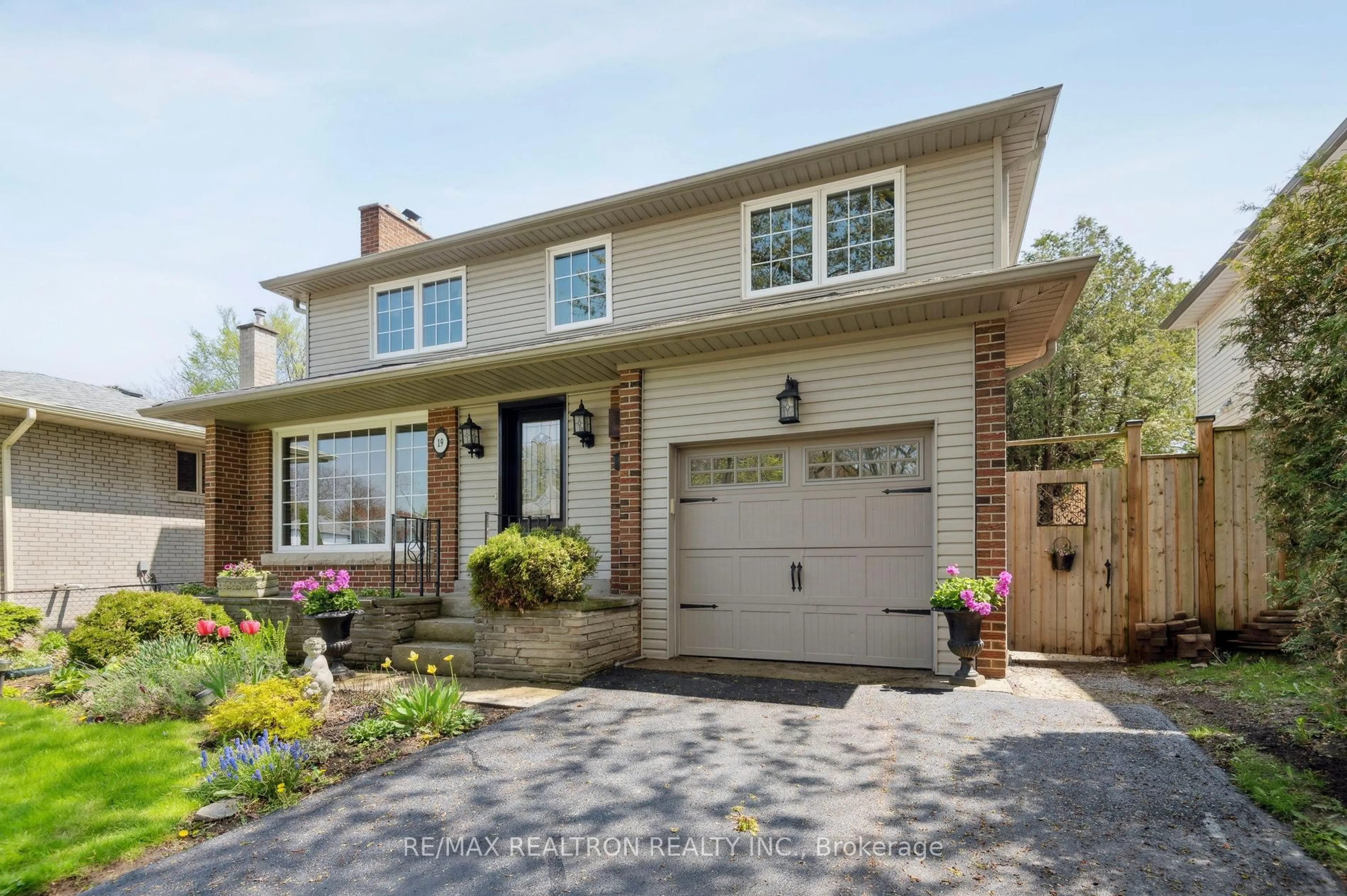 Home with brick exterior material, street for 19 Cathedral Bluffs Dr, Toronto Ontario M1M 2T6