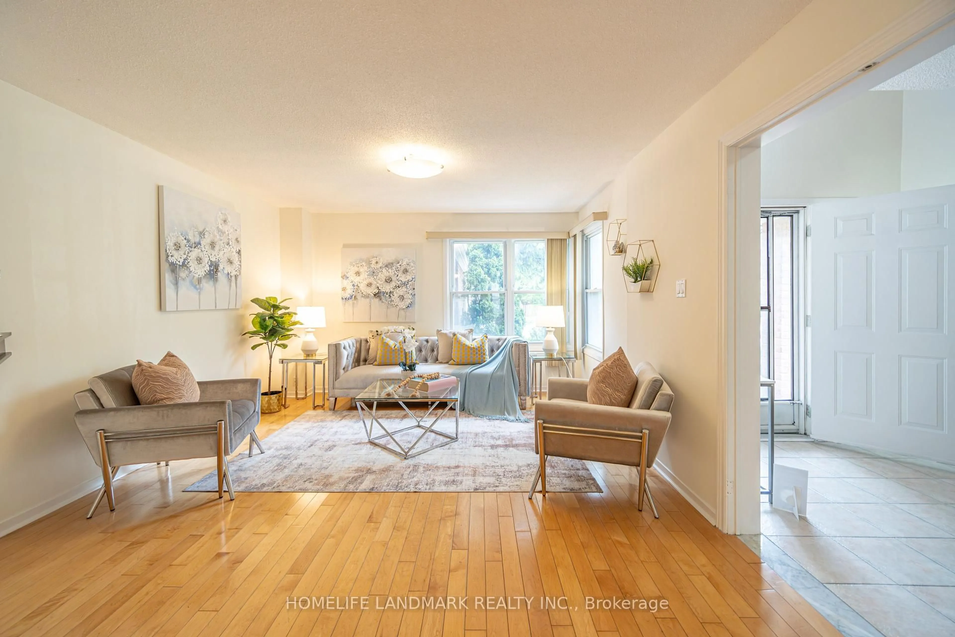 Living room with furniture, wood/laminate floor for 98 Ecclesfield Dr, Toronto Ontario M1W 3J6
