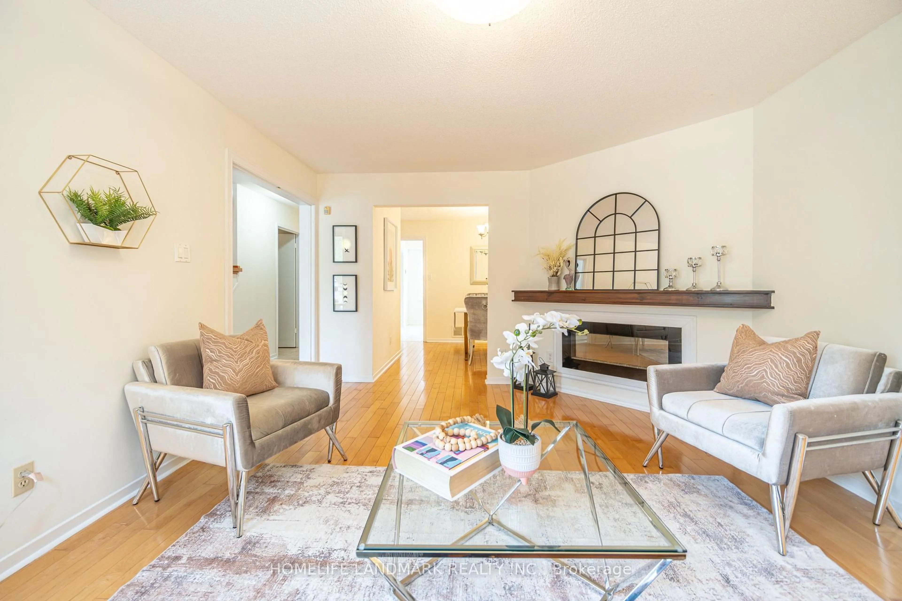 Living room with furniture, wood/laminate floor for 98 Ecclesfield Dr, Toronto Ontario M1W 3J6