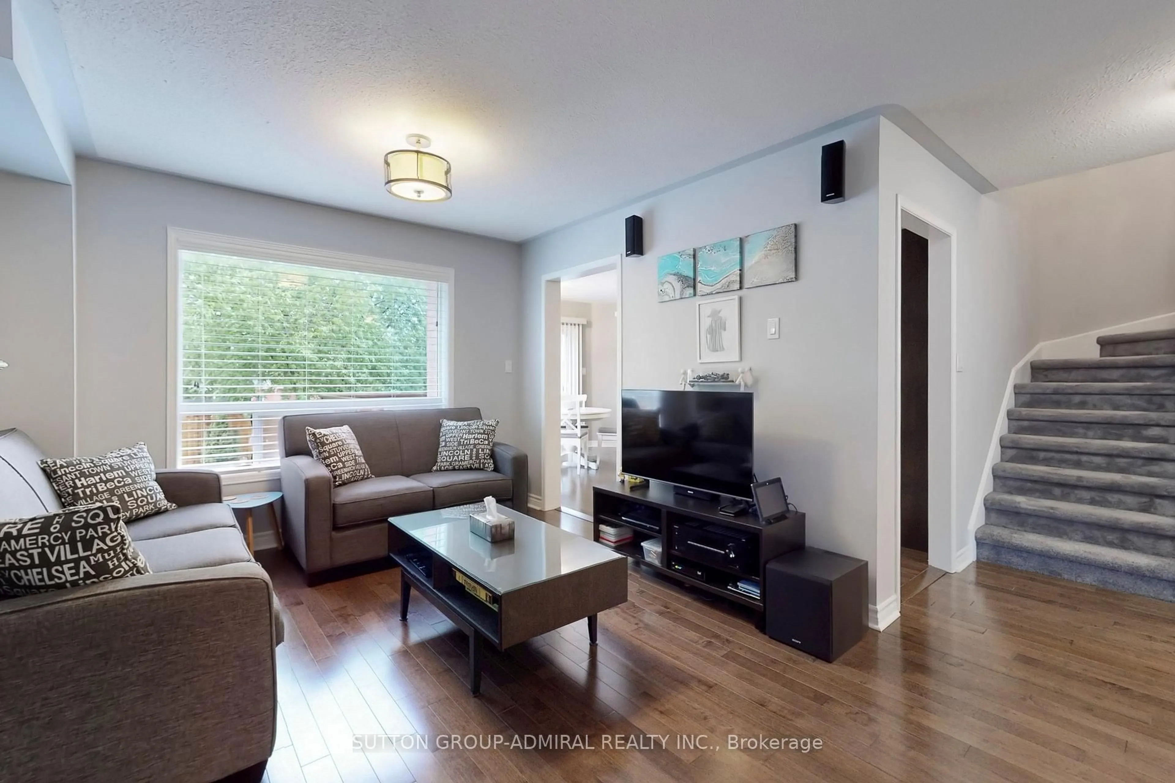 Living room with furniture, wood/laminate floor for 4 Blanchard Crt, Whitby Ontario L1M 1H5
