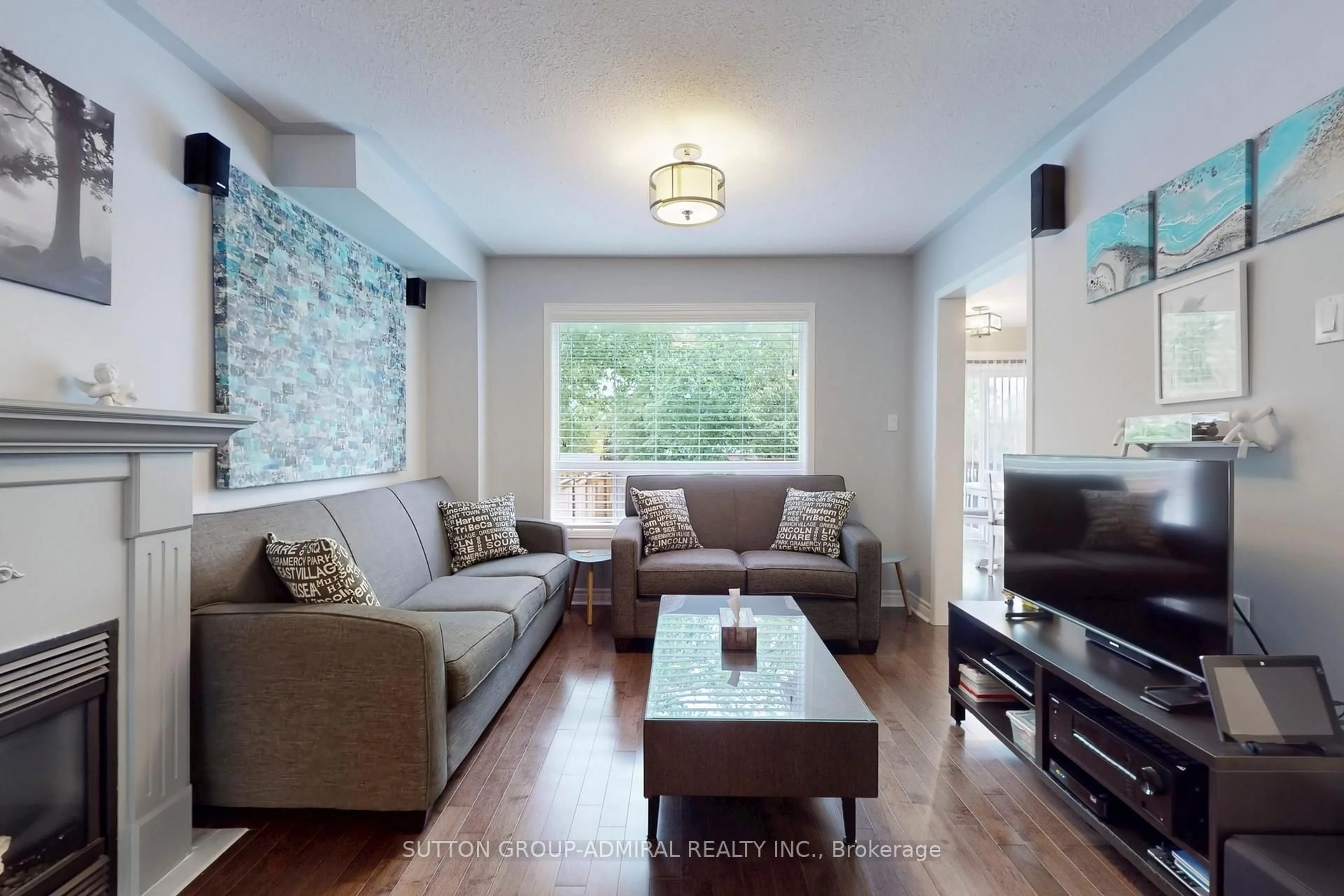 Living room with furniture, wood/laminate floor for 4 Blanchard Crt, Whitby Ontario L1M 1H5