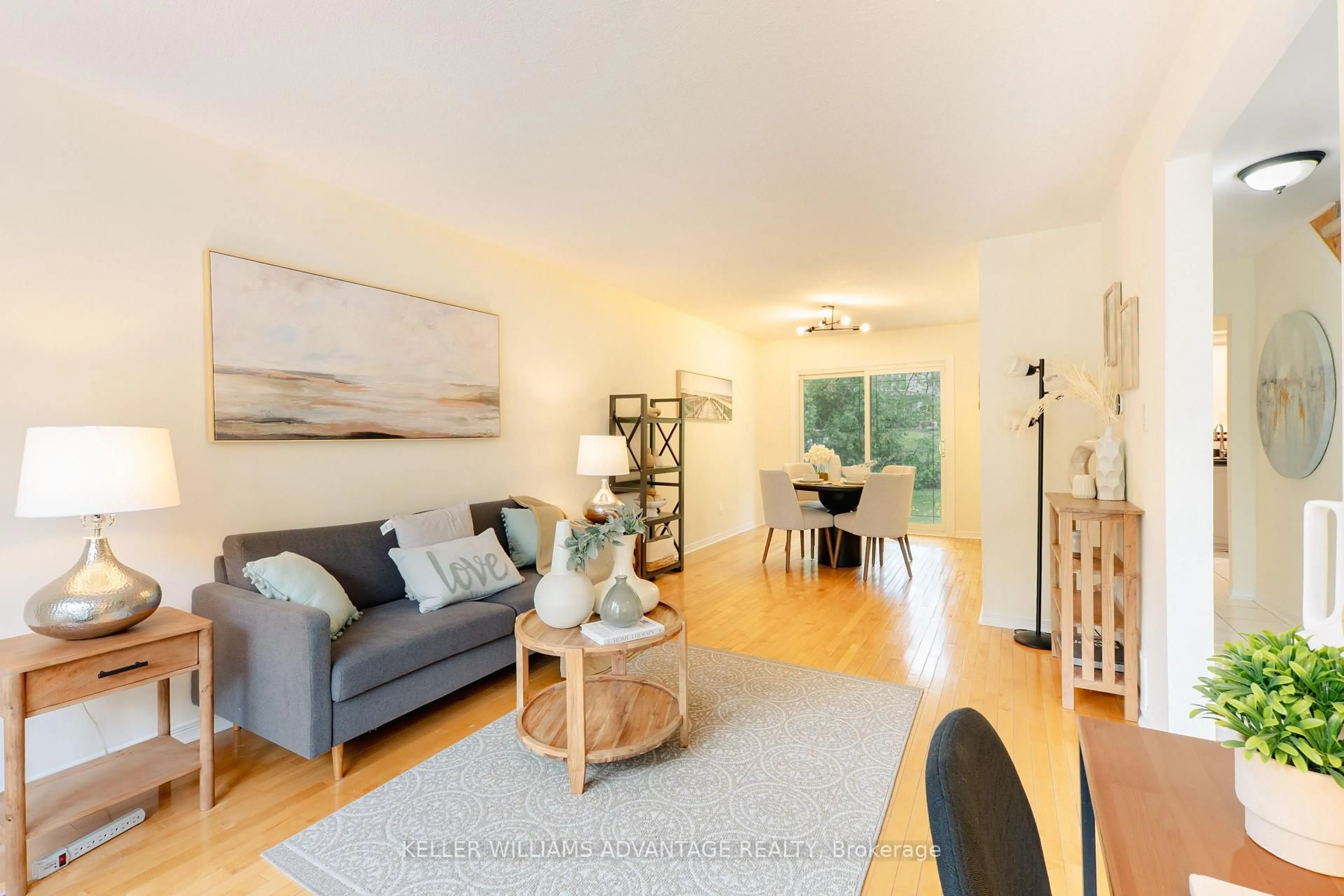 Living room with furniture, wood/laminate floor for 66 Tudor Glen Cres, Toronto Ontario M1C 2S2