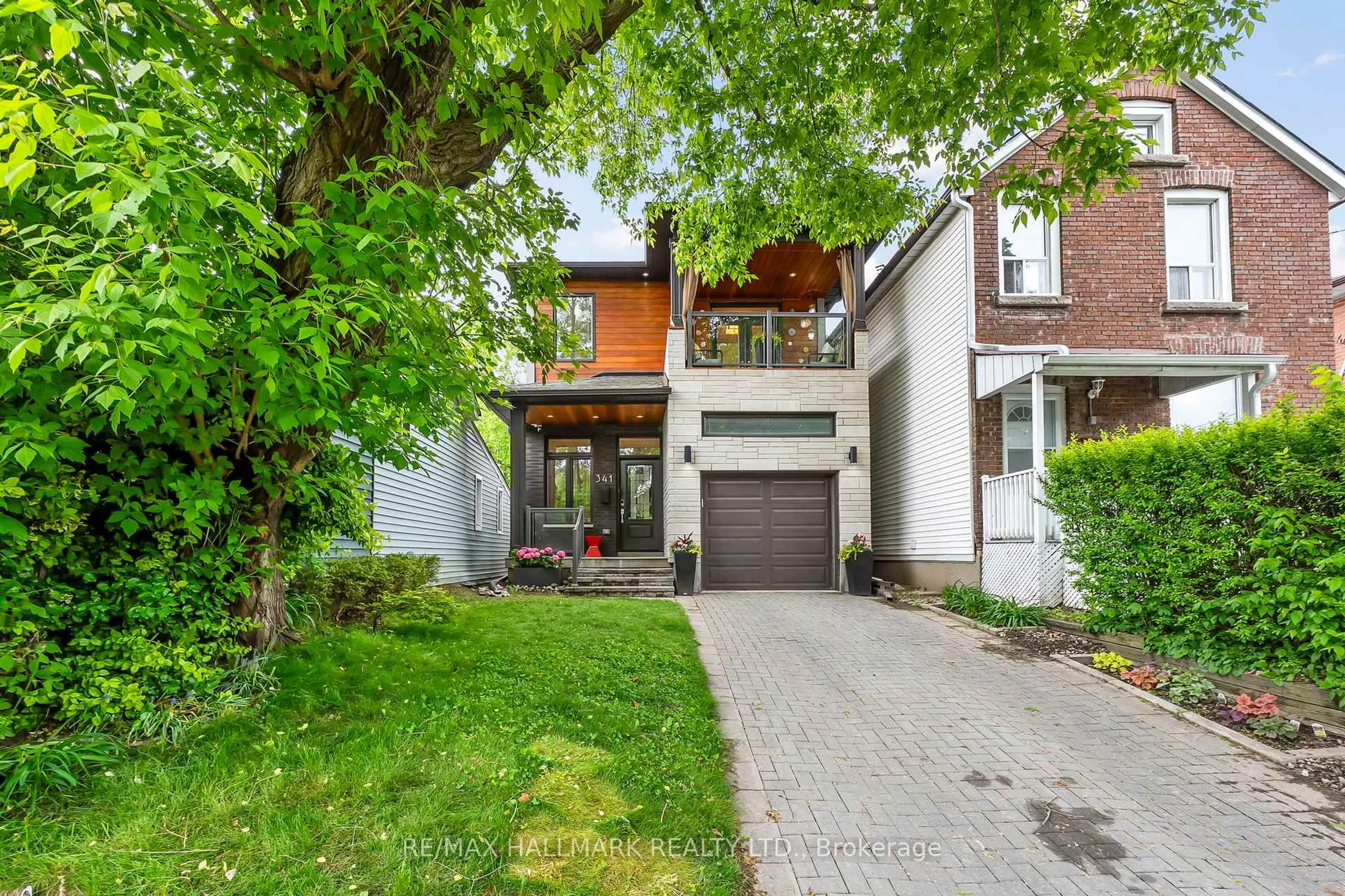 Home with brick exterior material, street for 341 Rhodes Ave, Toronto Ontario M4L 3A4