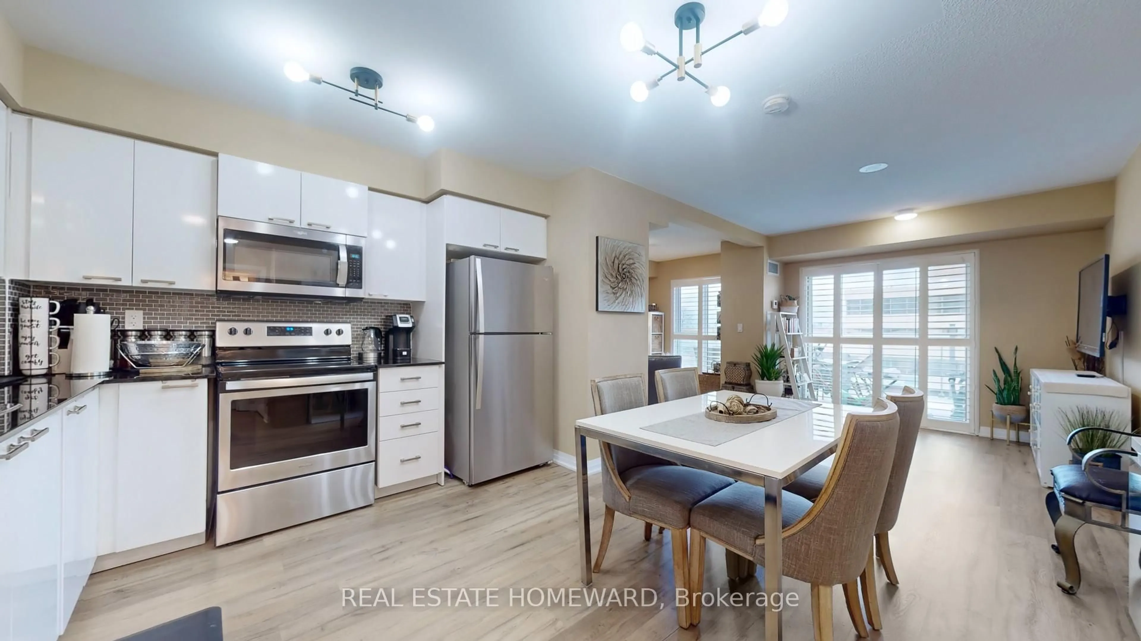 Open concept kitchen, wood/laminate floor for 2150 Lawrence Ave #305, Toronto Ontario M1R 3A7