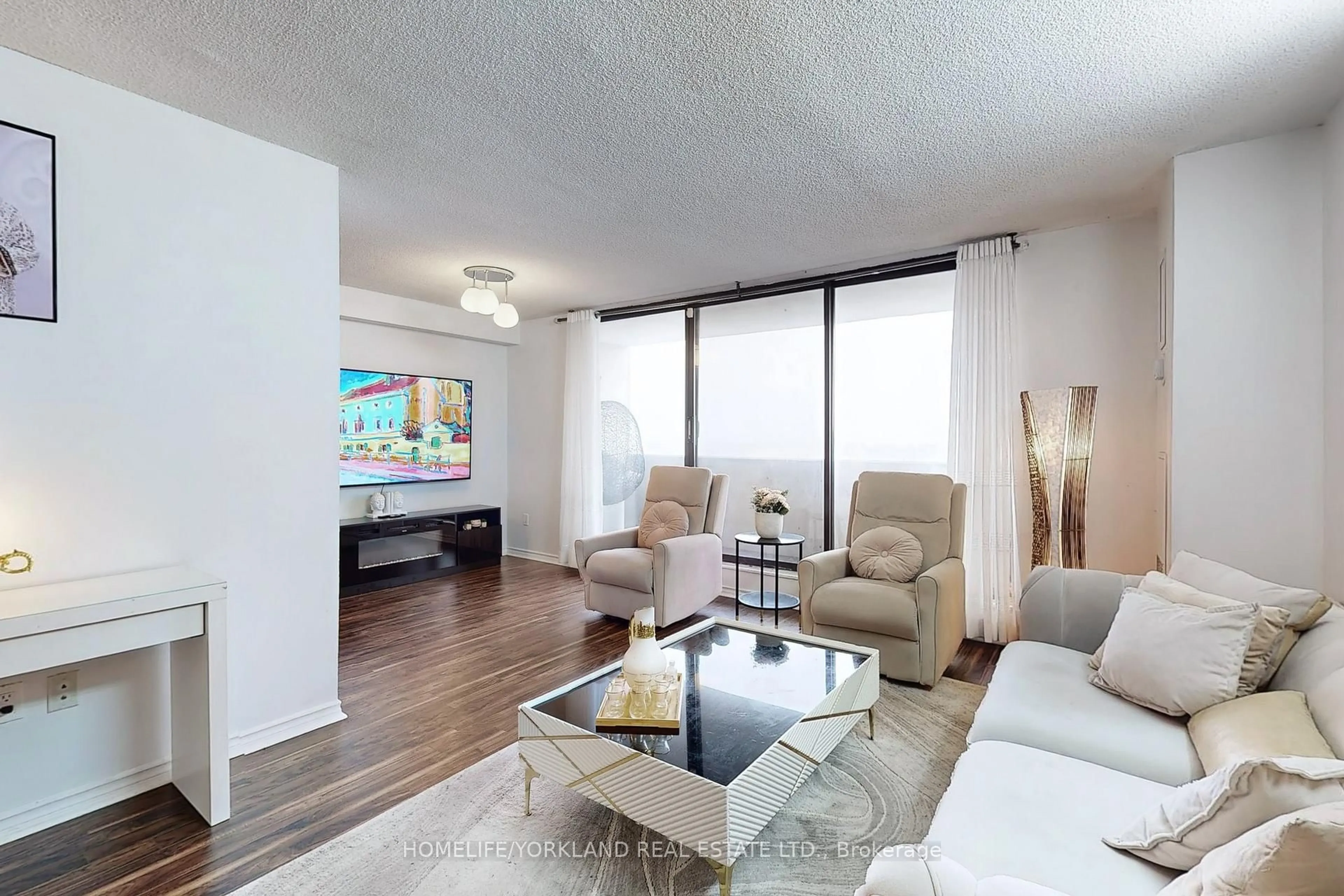 Living room with furniture, wood/laminate floor for 301 Prudential Dr #1111, Toronto Ontario M1P 4V3