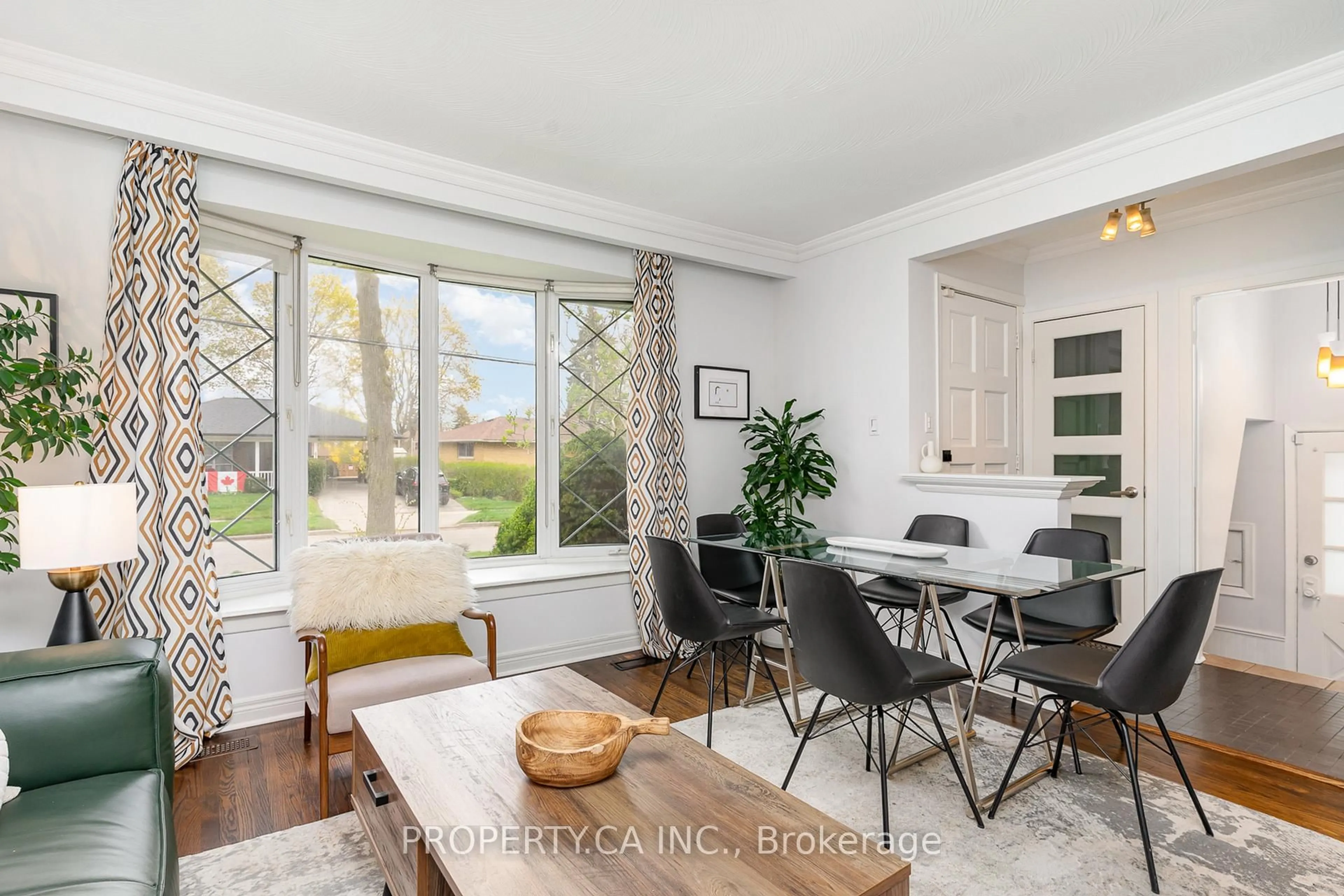 Living room with furniture, wood/laminate floor for 42 Fintona Ave, Toronto Ontario M1E 1V3