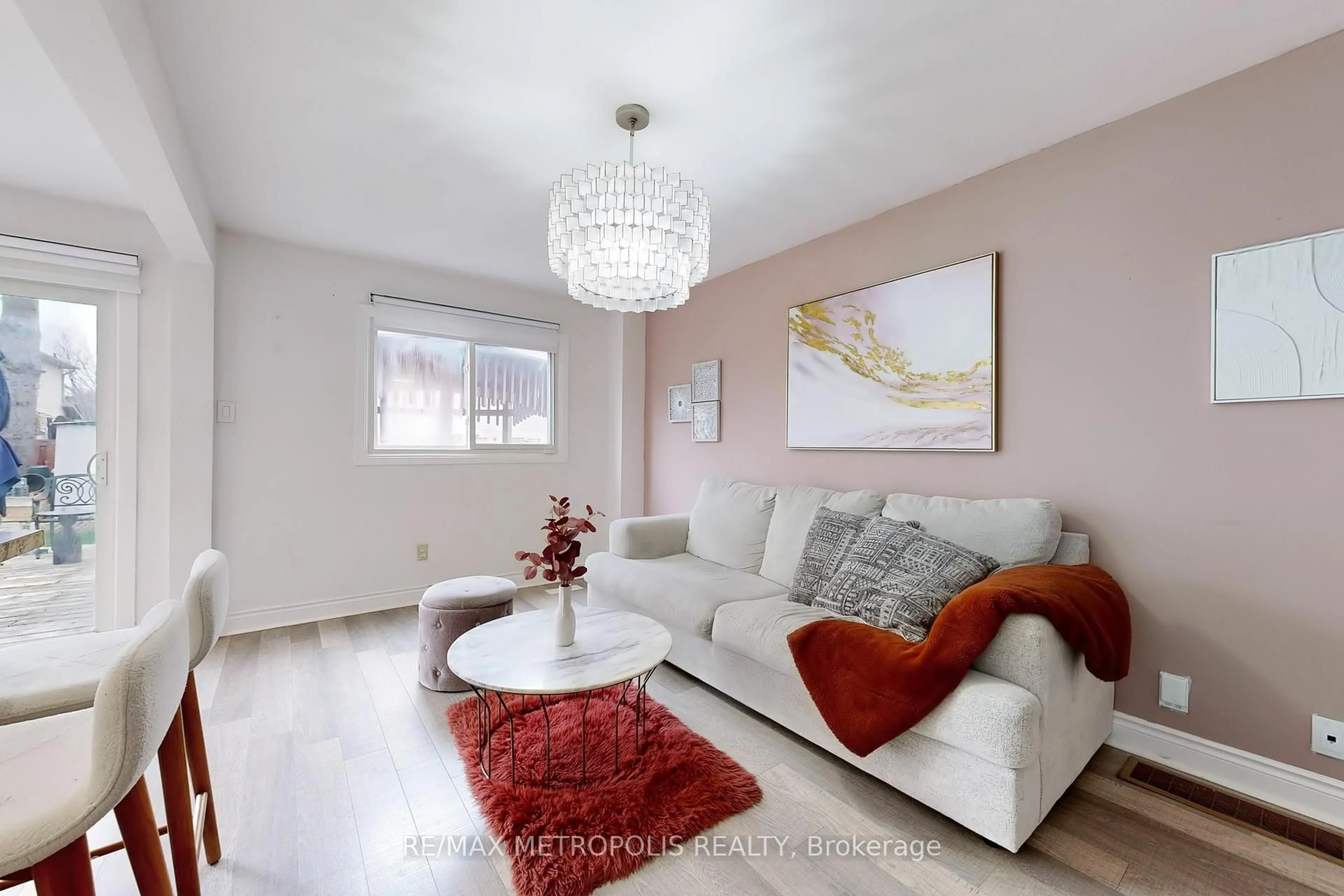 Living room with furniture, wood/laminate floor for 574 Cobblehill Dr, Oshawa Ontario L1K 1R4