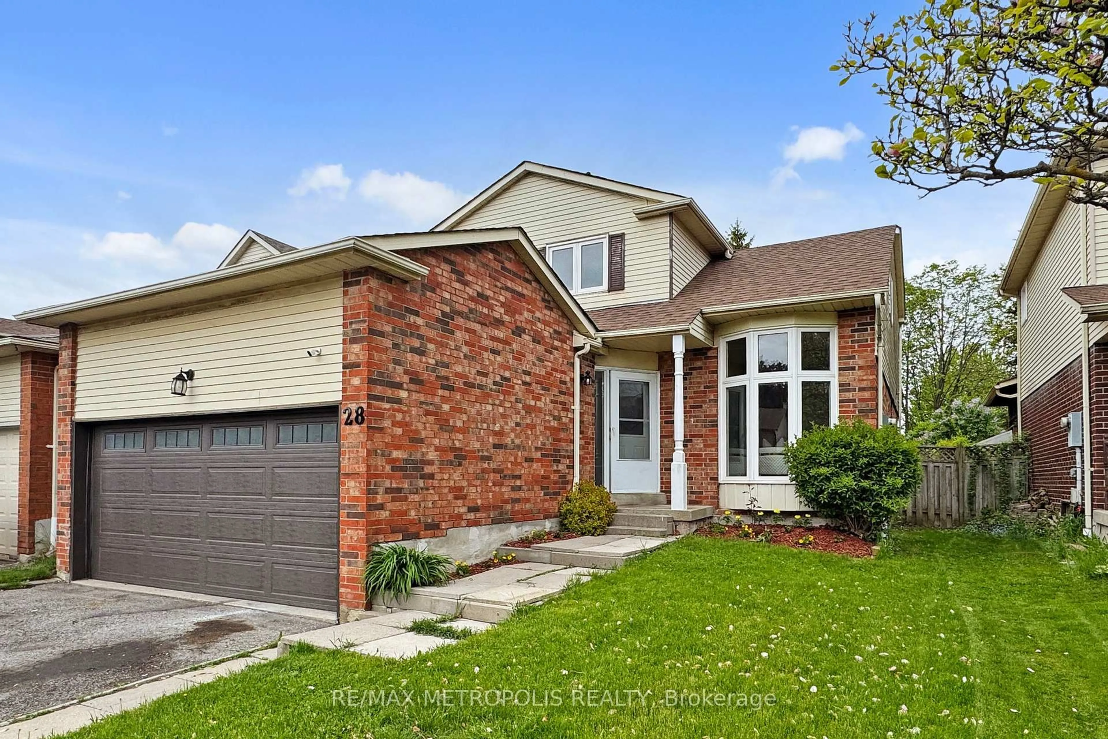 Home with brick exterior material, street for 28 Reed Dr, Ajax Ontario L1S 5S1