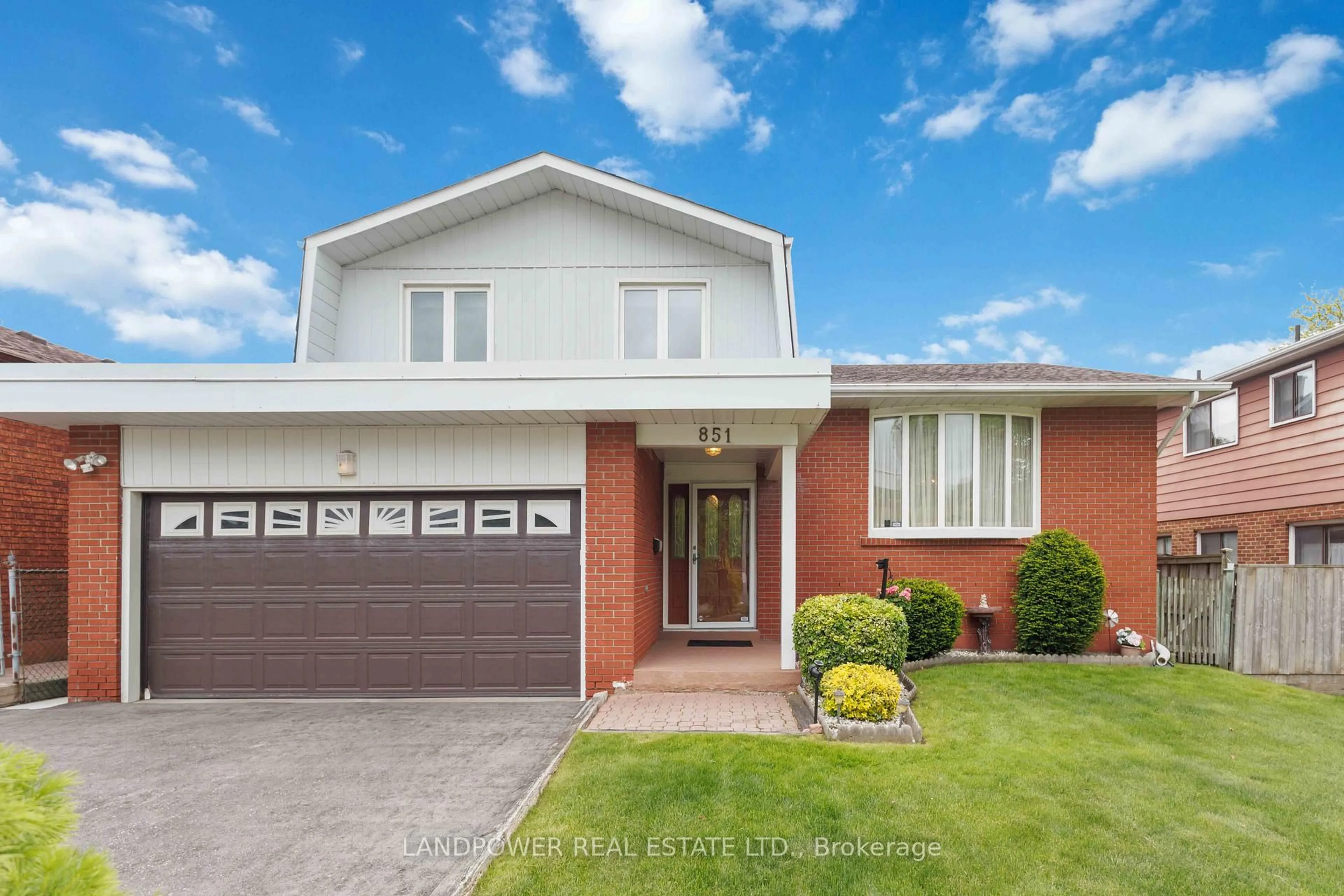 Home with brick exterior material, street for 851 Huntingwood Dr, Toronto Ontario M1T 3L7