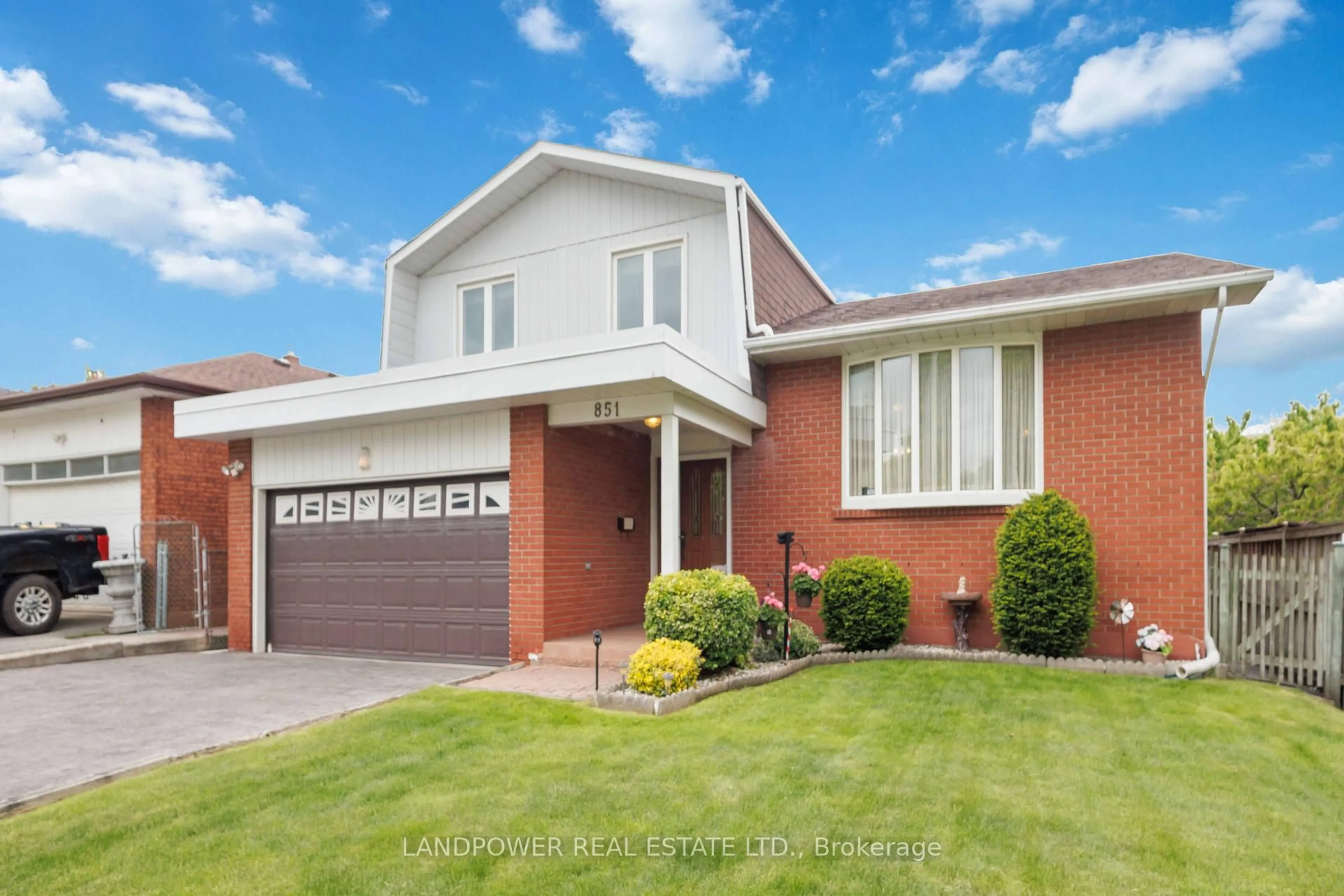 Home with brick exterior material, street for 851 Huntingwood Dr, Toronto Ontario M1T 3L7