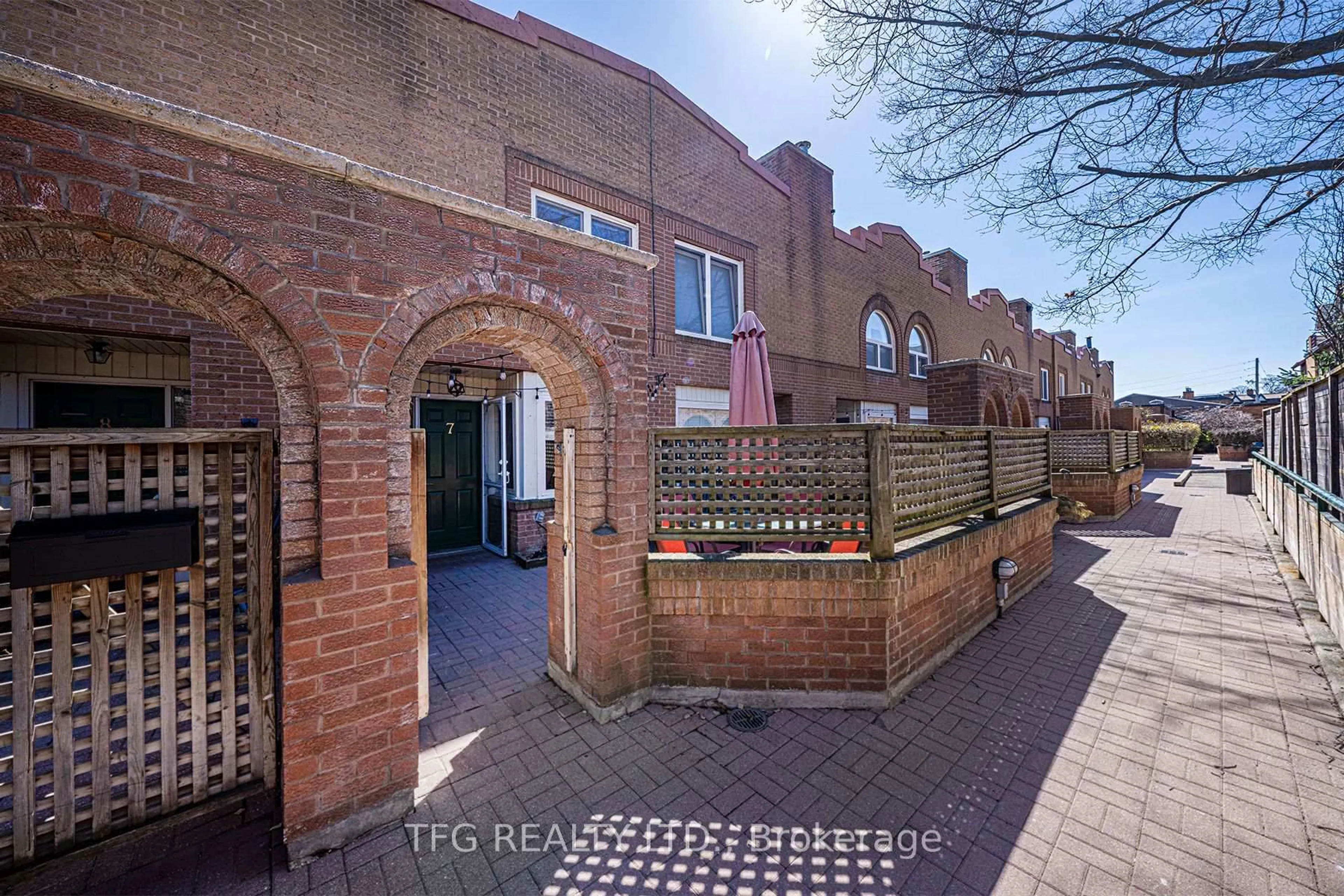 Home with brick exterior material, street for 120 Glen Manor Dr #7, Toronto Ontario M4E 2X6
