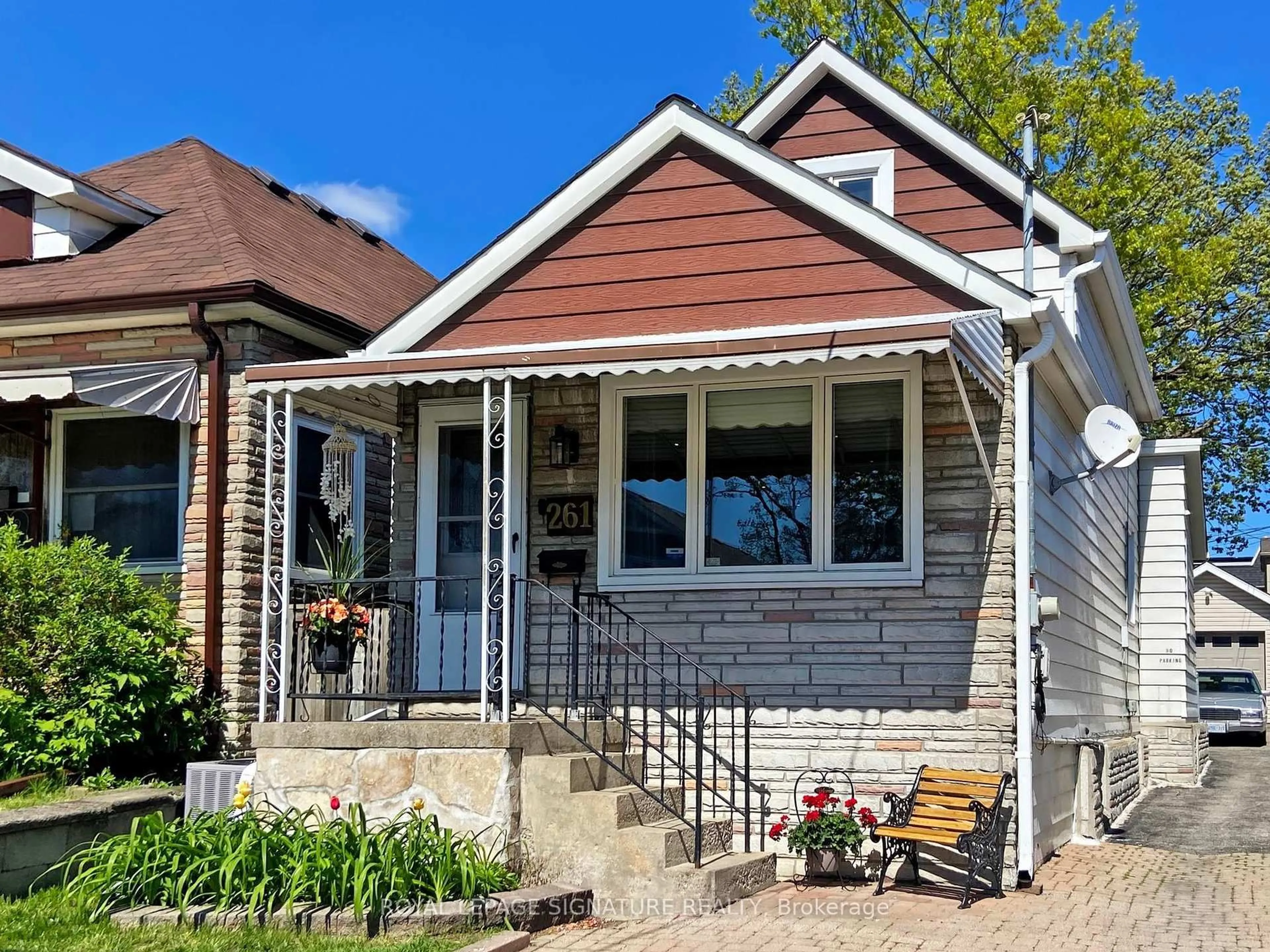Home with brick exterior material, street for 261 Glebemount Ave, Toronto Ontario M4C 3T7
