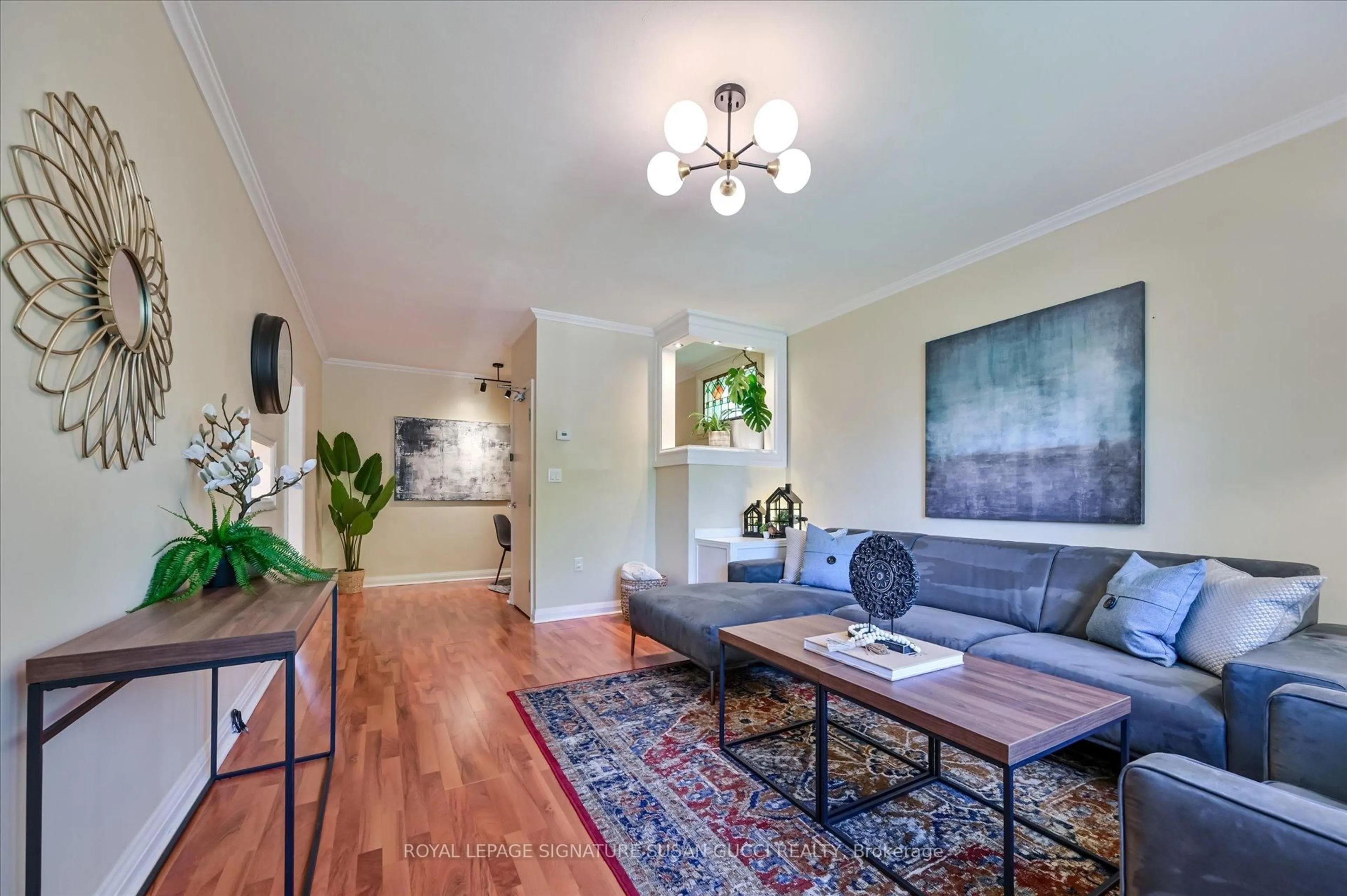 Living room with furniture, wood/laminate floor for 1006 Victoria Park Ave, Toronto Ontario M4B 2J6