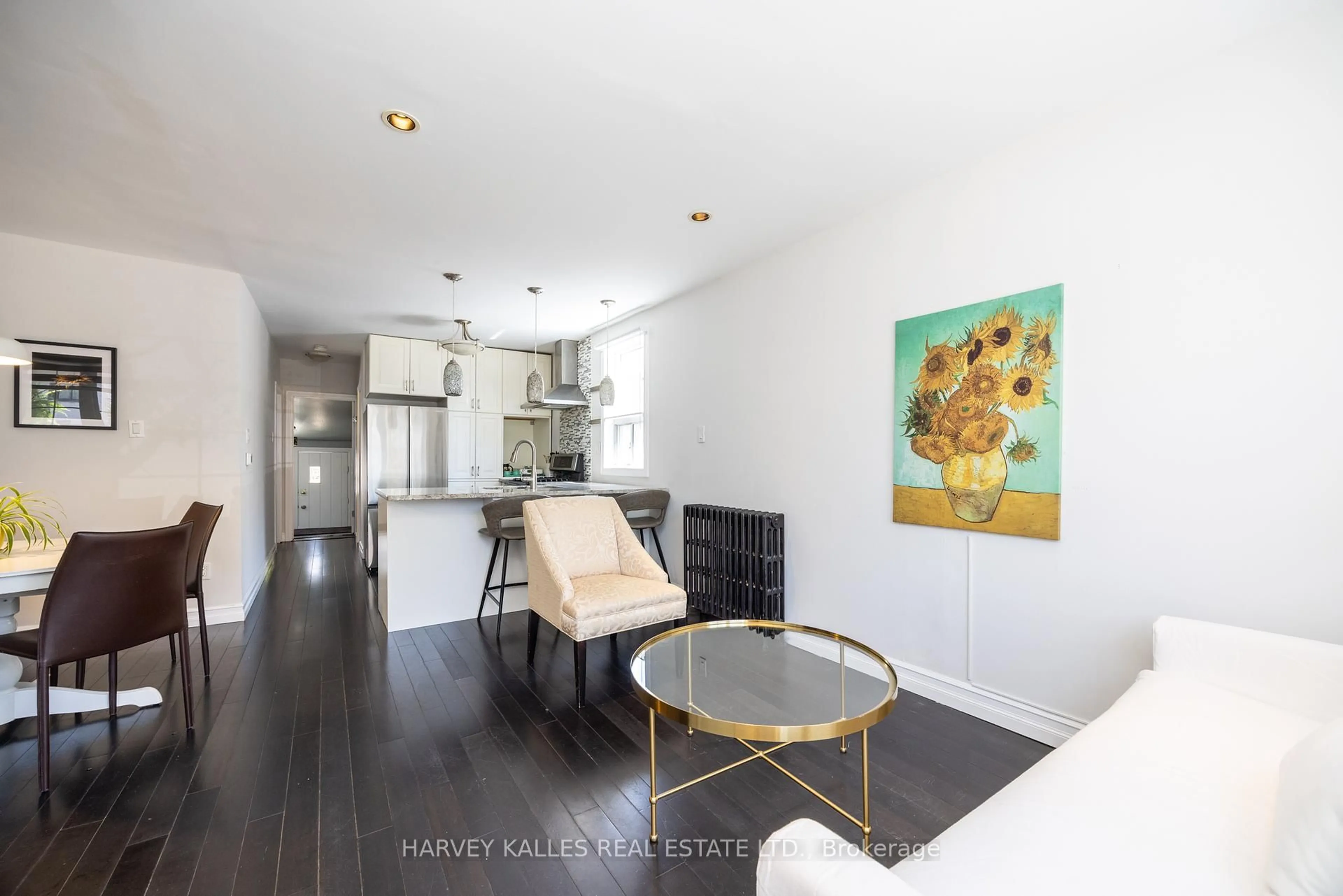 Open concept kitchen, wood/laminate floor for 210 Gowan Ave, Toronto Ontario M4J 2K6