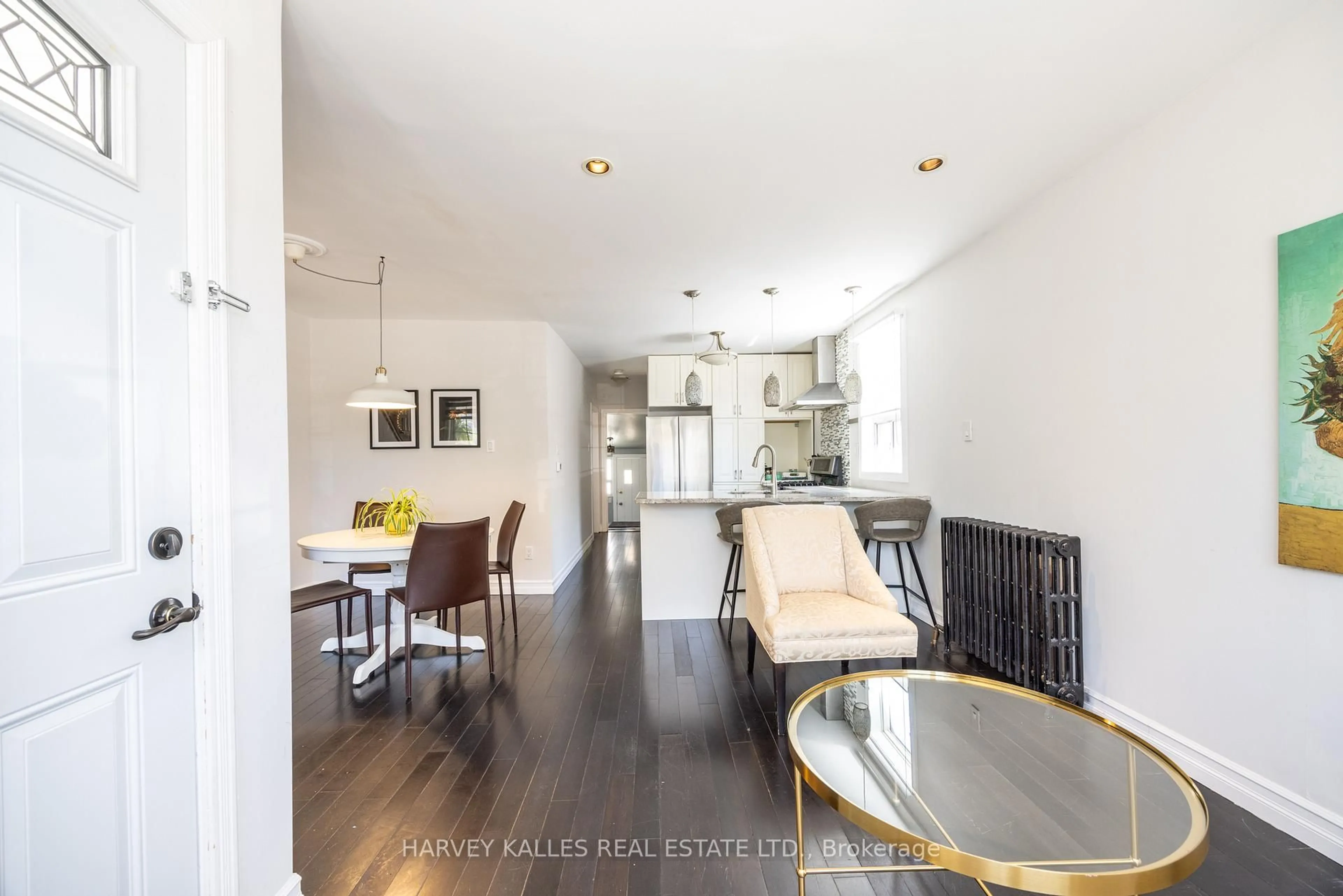 Open concept kitchen, wood/laminate floor for 210 Gowan Ave, Toronto Ontario M4J 2K6