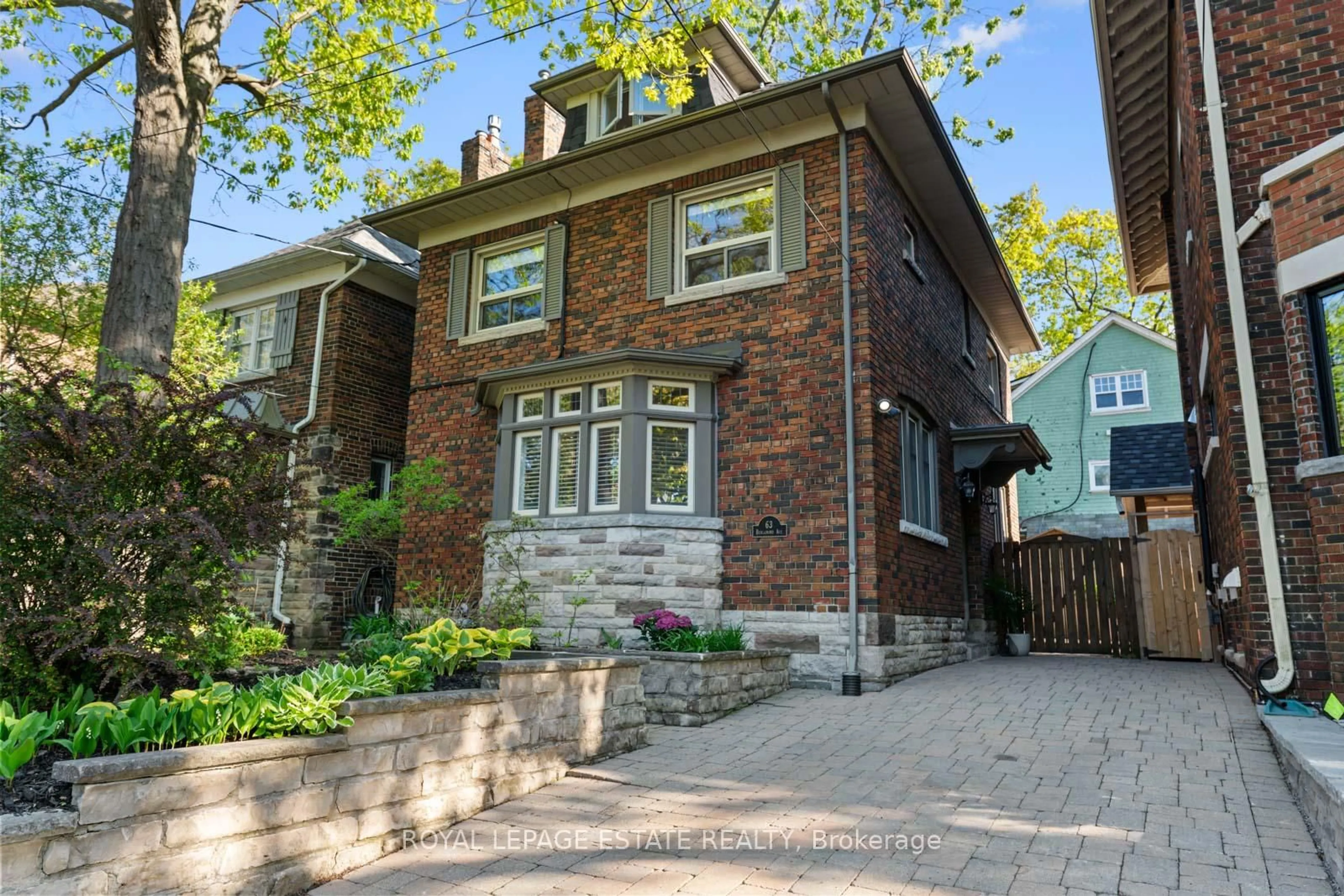 Home with brick exterior material, street for 63 Benlamond Ave, Toronto Ontario M4E 1Y8