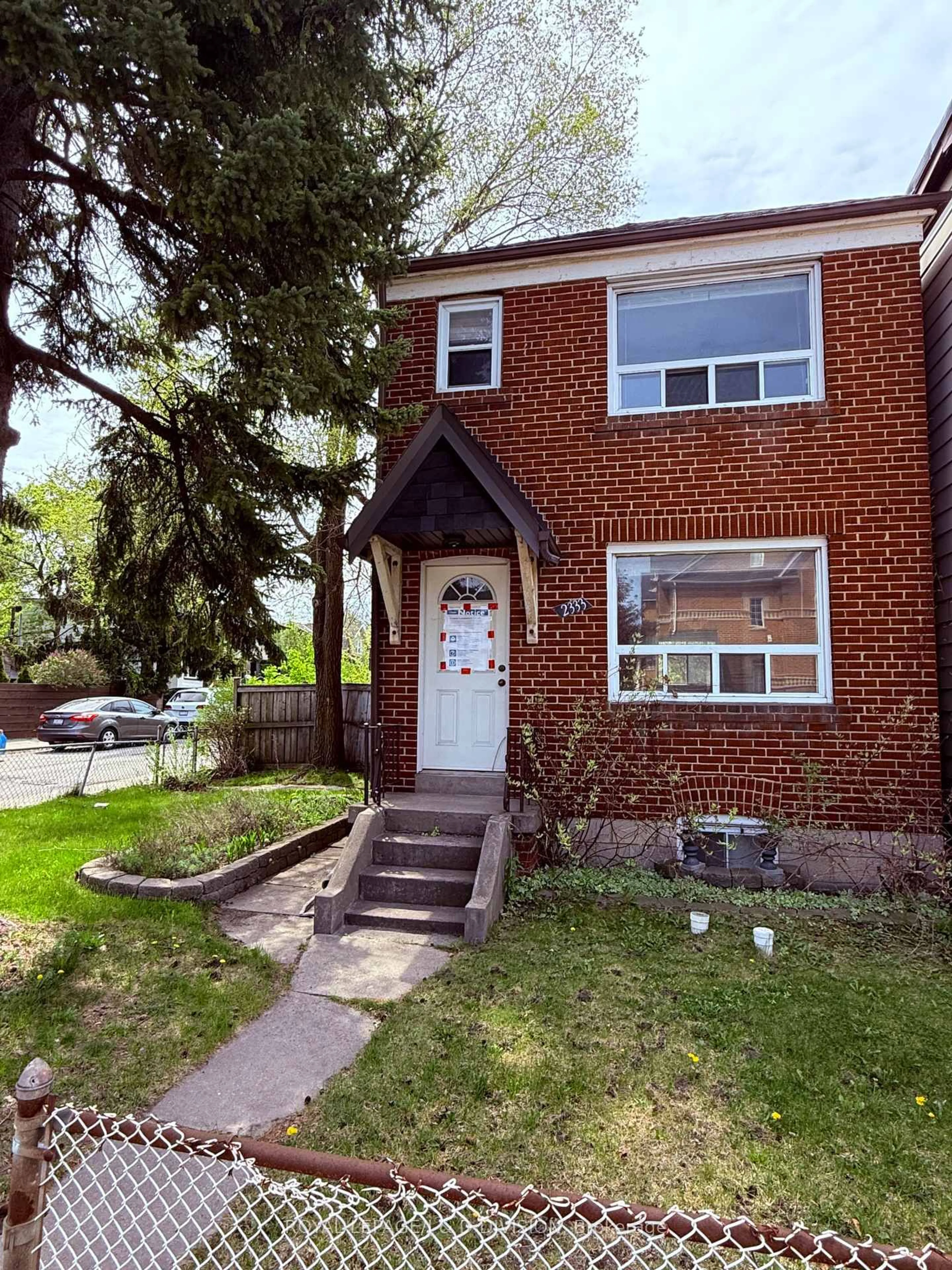 Home with brick exterior material, street for 2333 Gerrard St, Toronto Ontario M4E 2E5