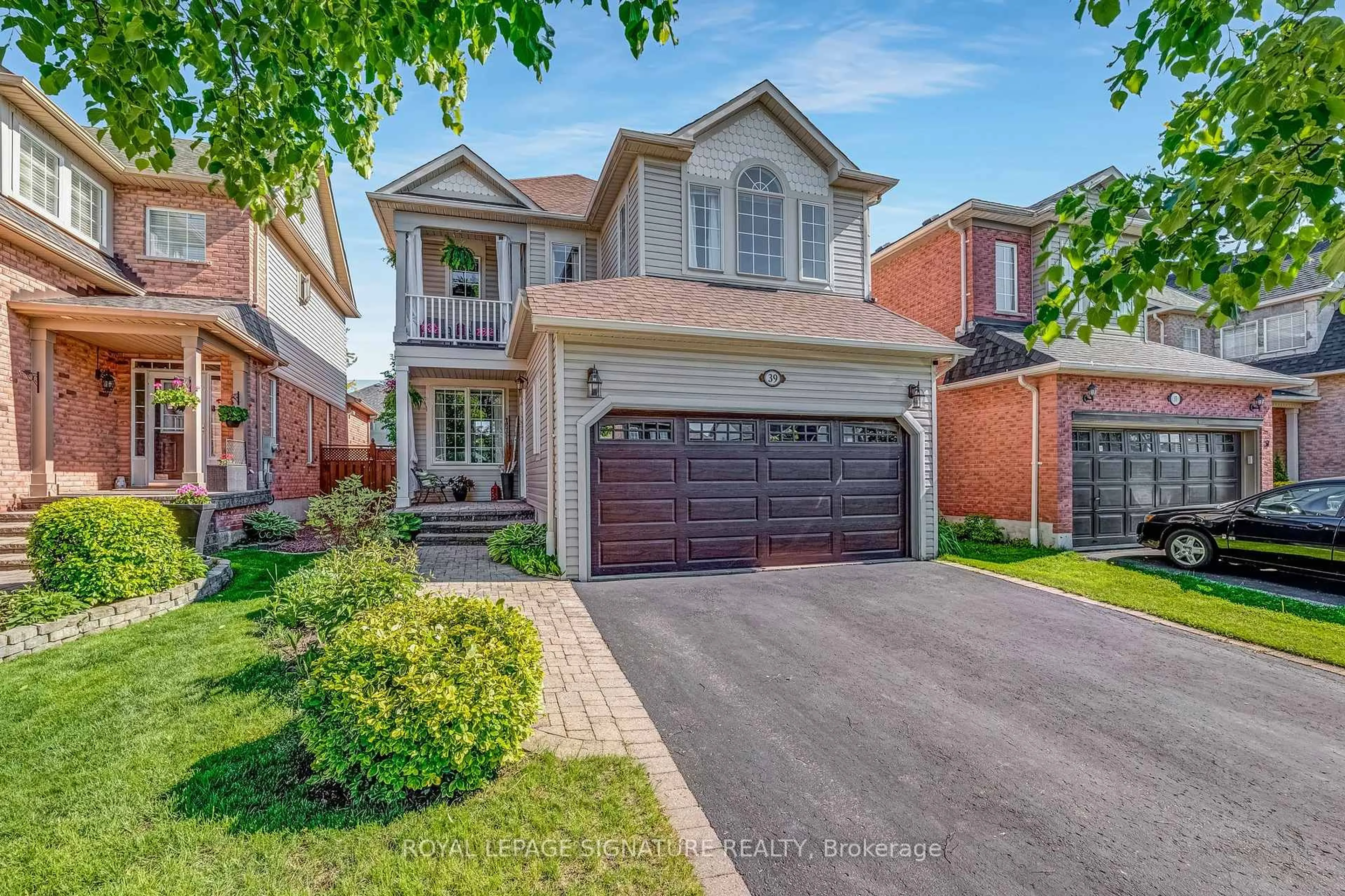 Home with brick exterior material, street for 39 Divine Dr, Whitby Ontario L1R 2T5