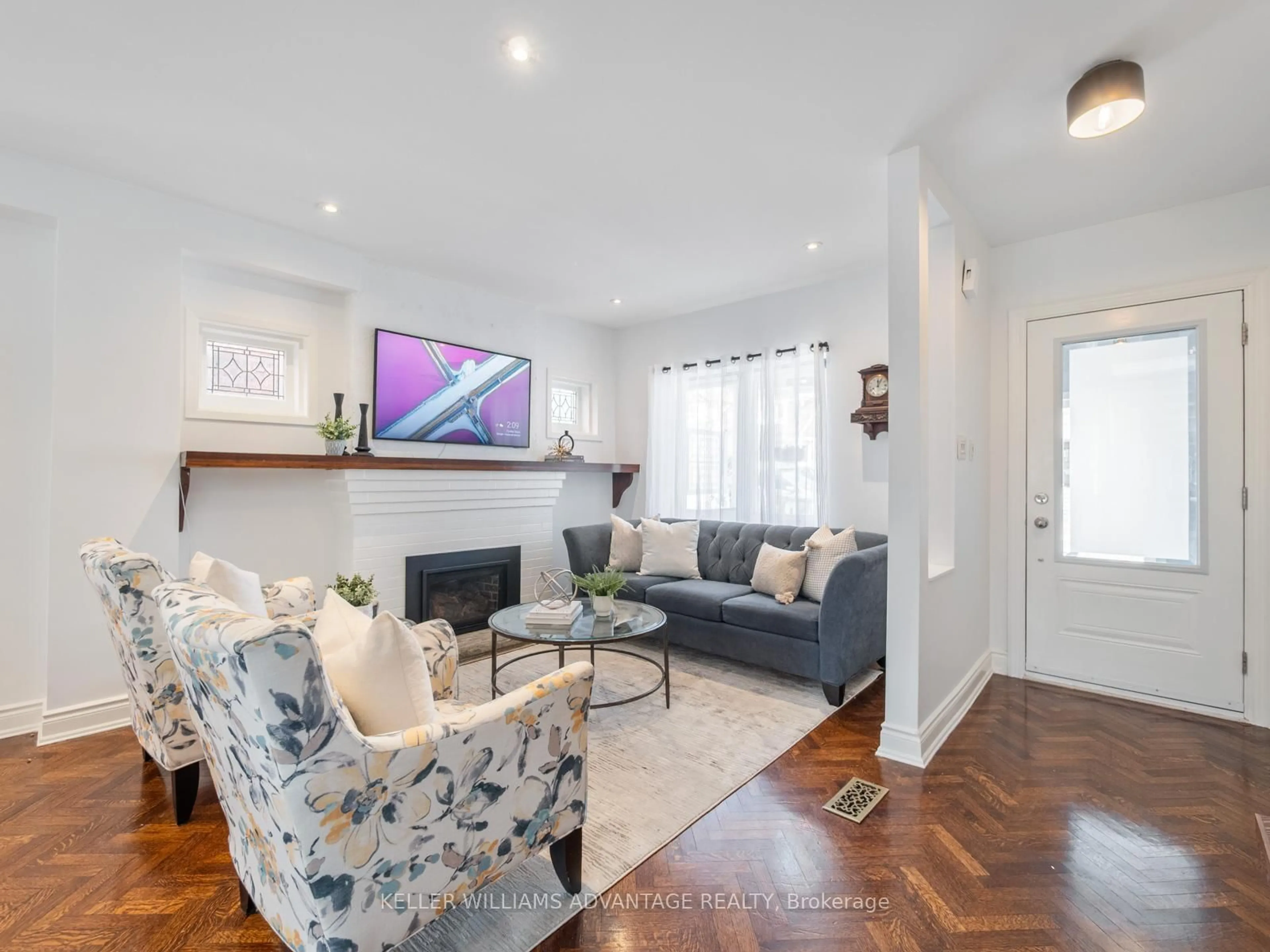 Living room with furniture, wood/laminate floor for 42 Normandy Blvd, Toronto Ontario M4L 3K2