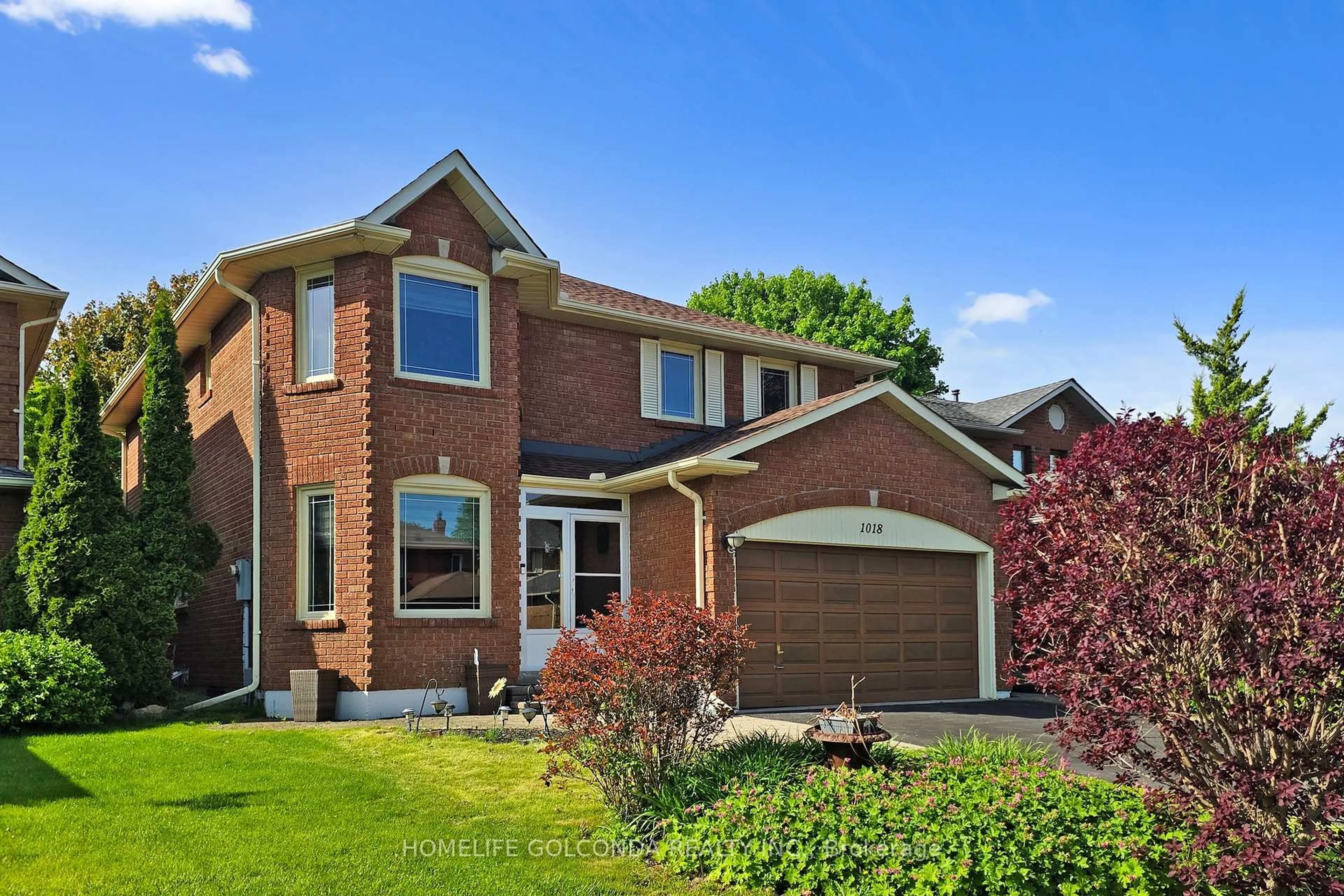 Home with brick exterior material, street for 1018 Rouge Valley Dr, Pickering Ontario L1V 4N7