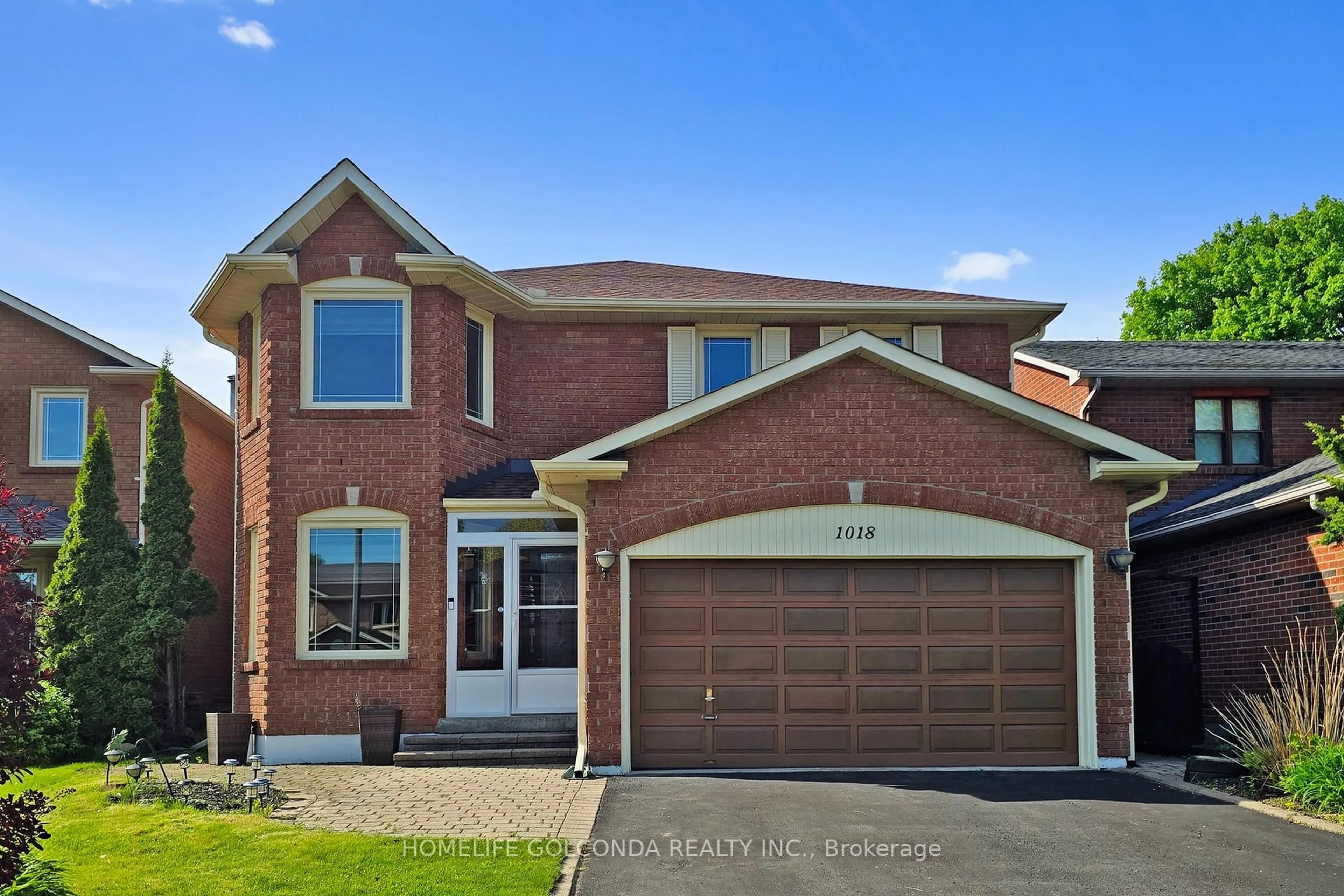 Home with brick exterior material, street for 1018 Rouge Valley Dr, Pickering Ontario L1V 4N7