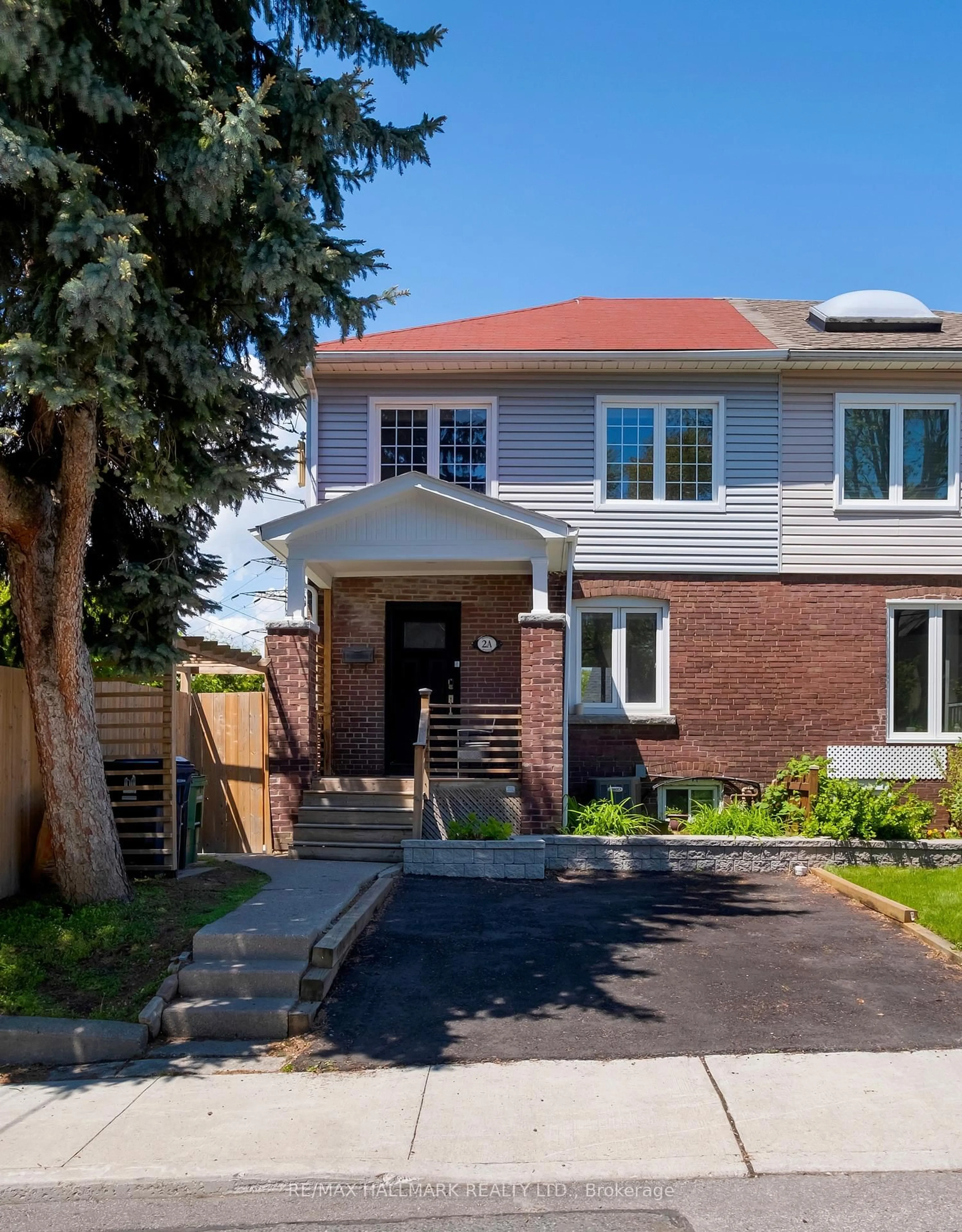 Home with brick exterior material, street for 2A Midburn Ave, Toronto Ontario M4C 2C9