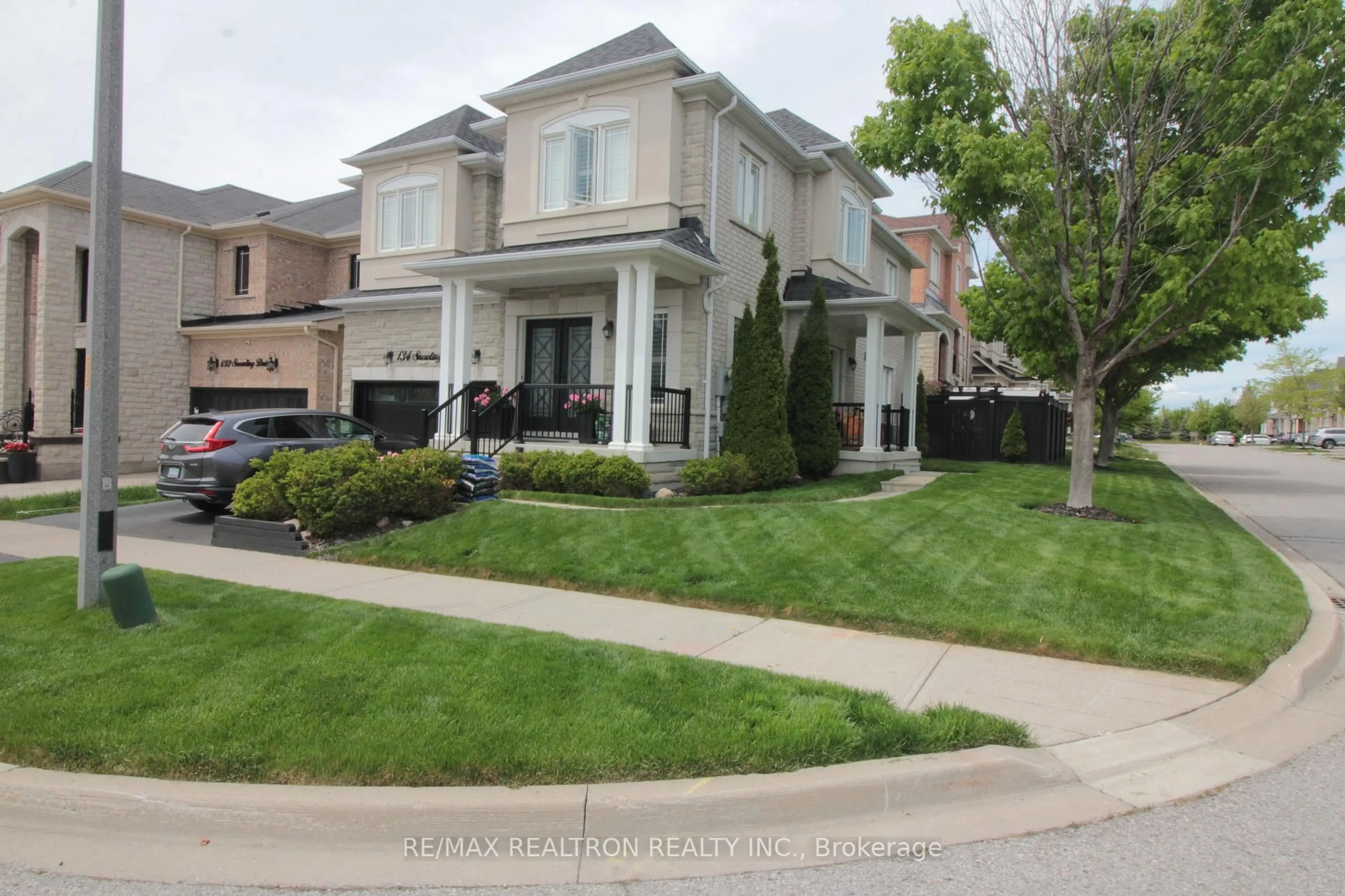 Home with vinyl exterior material, street for 134 Snowling Dr, Ajax Ontario L1Z 0G3