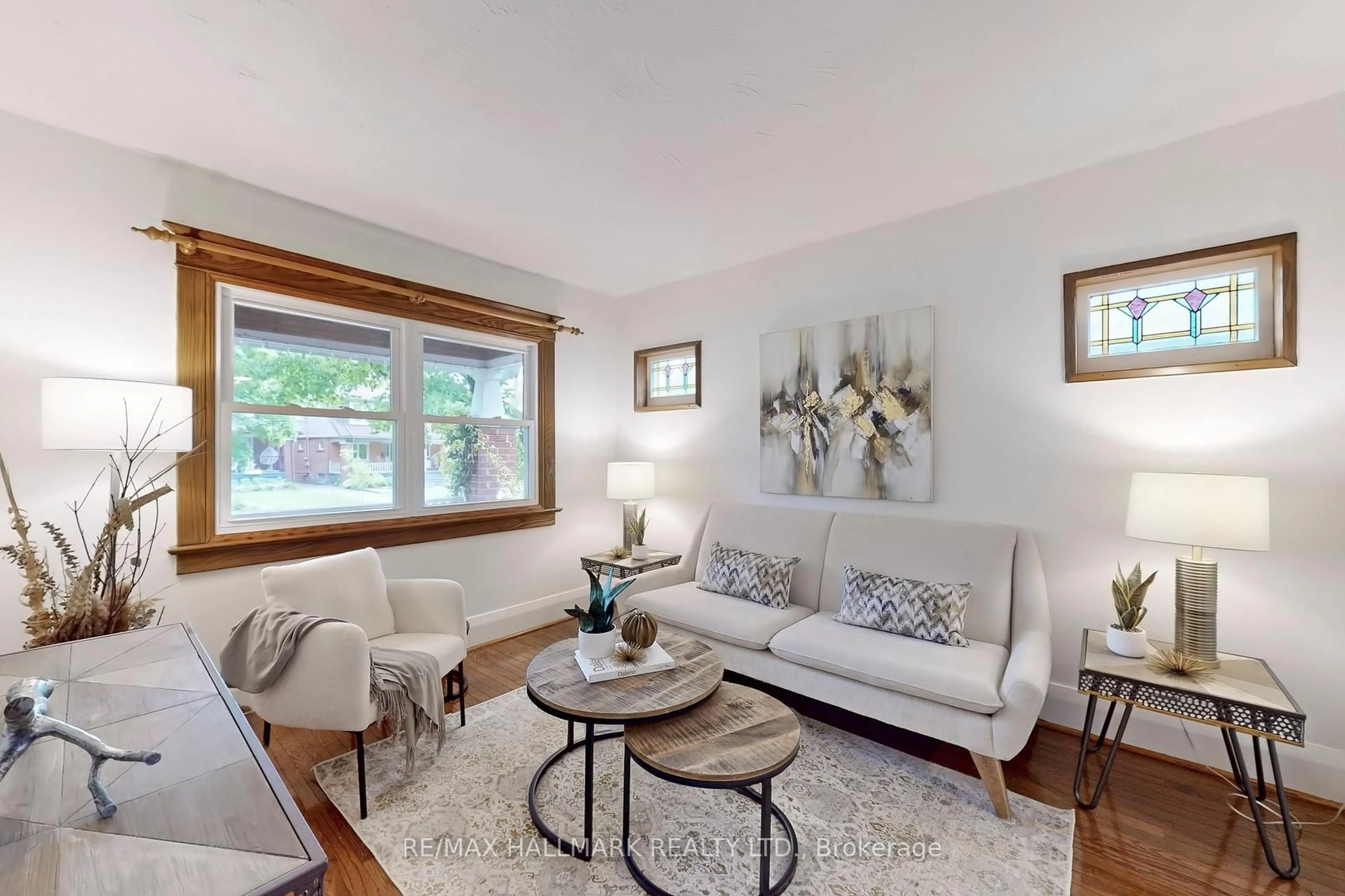 Living room with furniture, wood/laminate floor for 54 Wildwood Cres, Toronto Ontario M4L 2K7