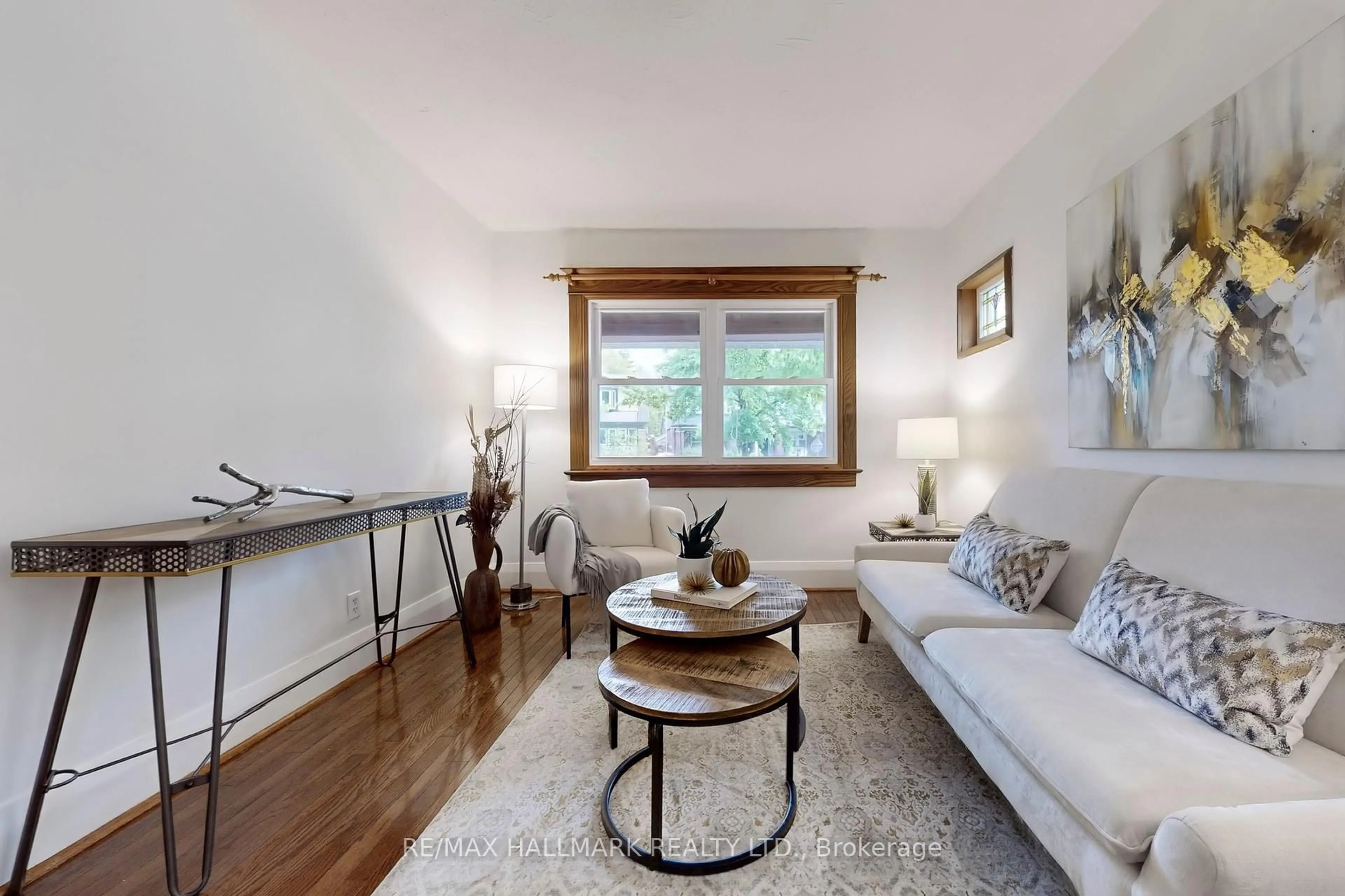 Living room with furniture, wood/laminate floor for 54 Wildwood Cres, Toronto Ontario M4L 2K7