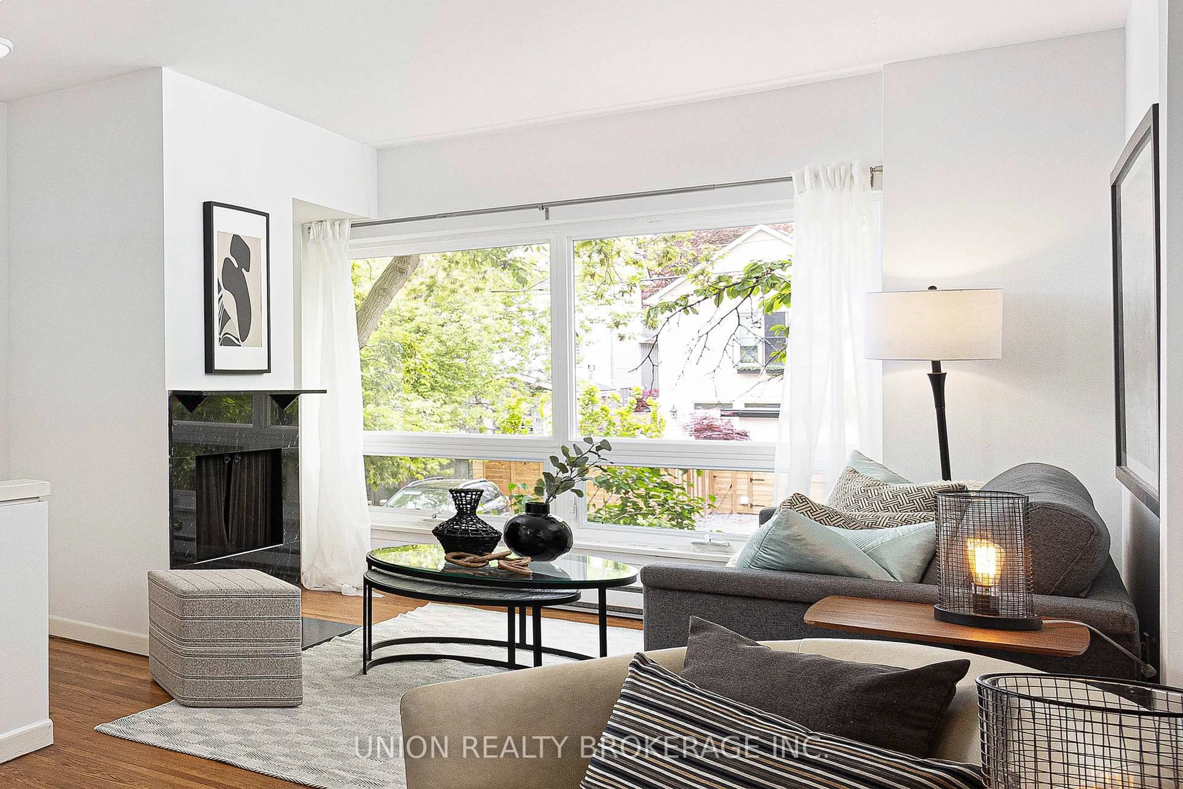Living room with furniture, wood/laminate floor for 232 Waverley Rd, Toronto Ontario M4L 3T3