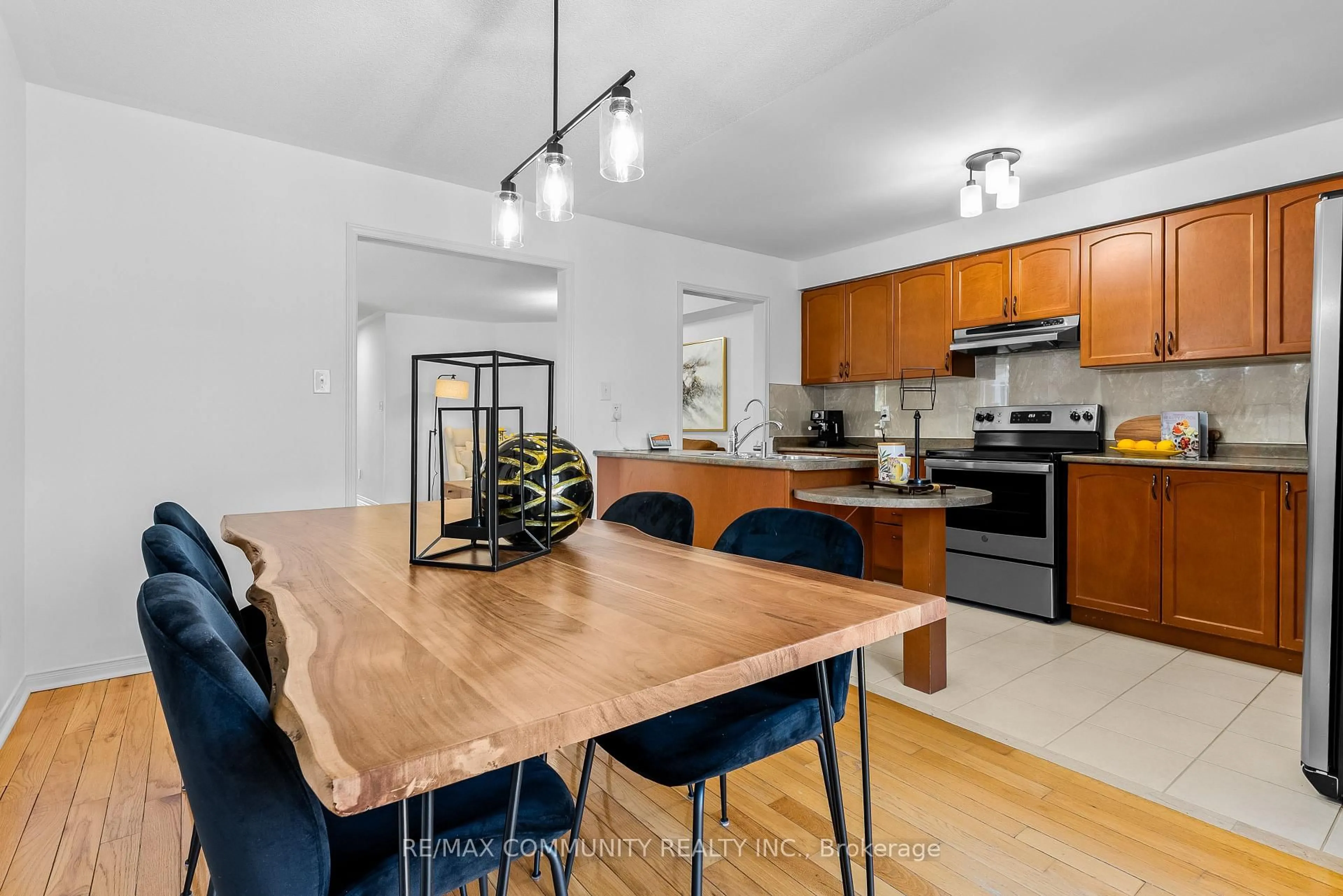 Open concept kitchen, wood/laminate floor for 28 Beer Cres, Ajax Ontario L1S 0A4
