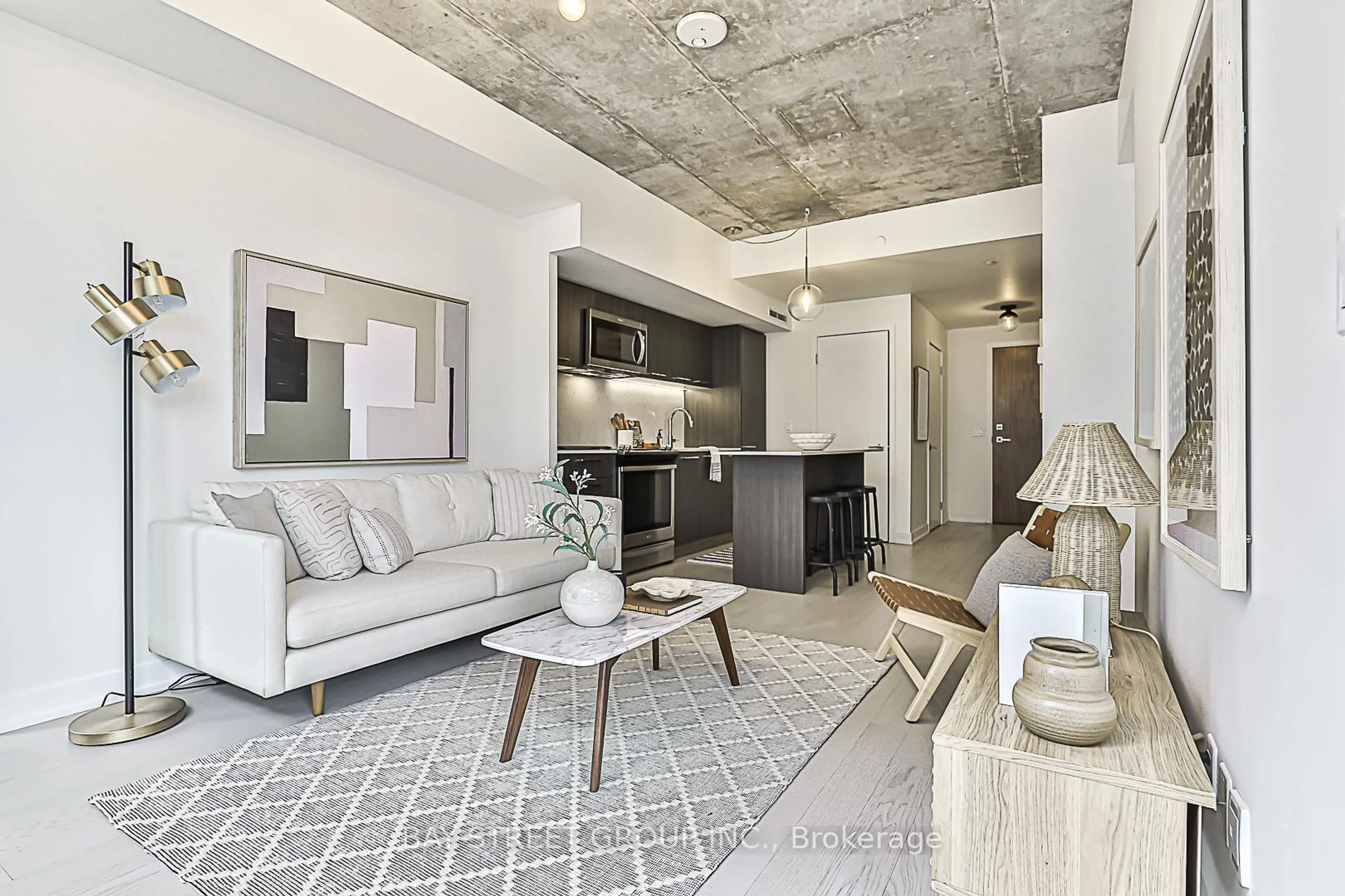 Living room with furniture, cement floor for 15 Baseball Pl #1001, Toronto Ontario M4M 0E6