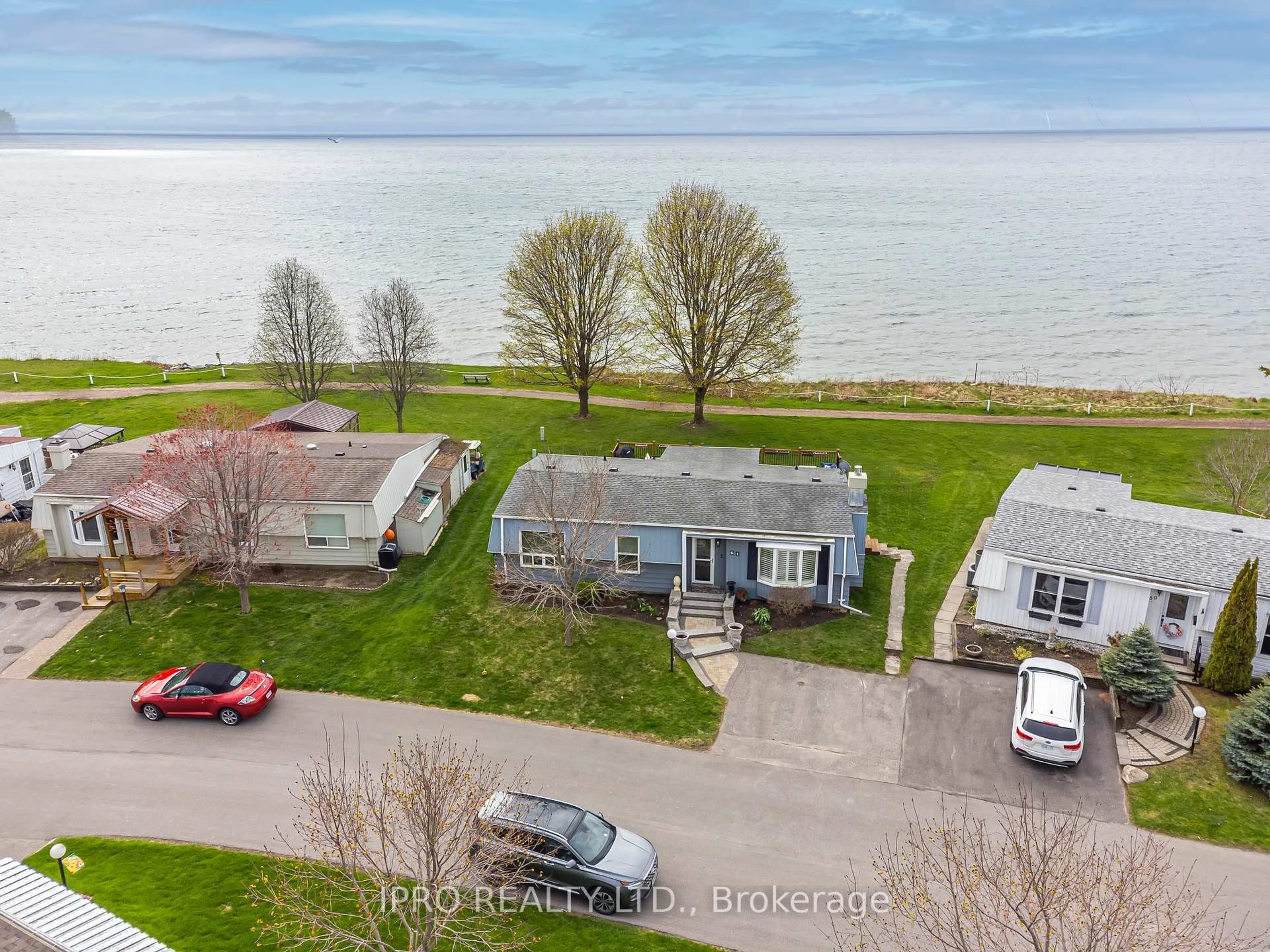 A pic from outside/outdoor area/front of a property/back of a property/a pic from drone, water/lake/river/ocean view for 61 Bluffs Rd, Clarington Ontario L1B 1A6