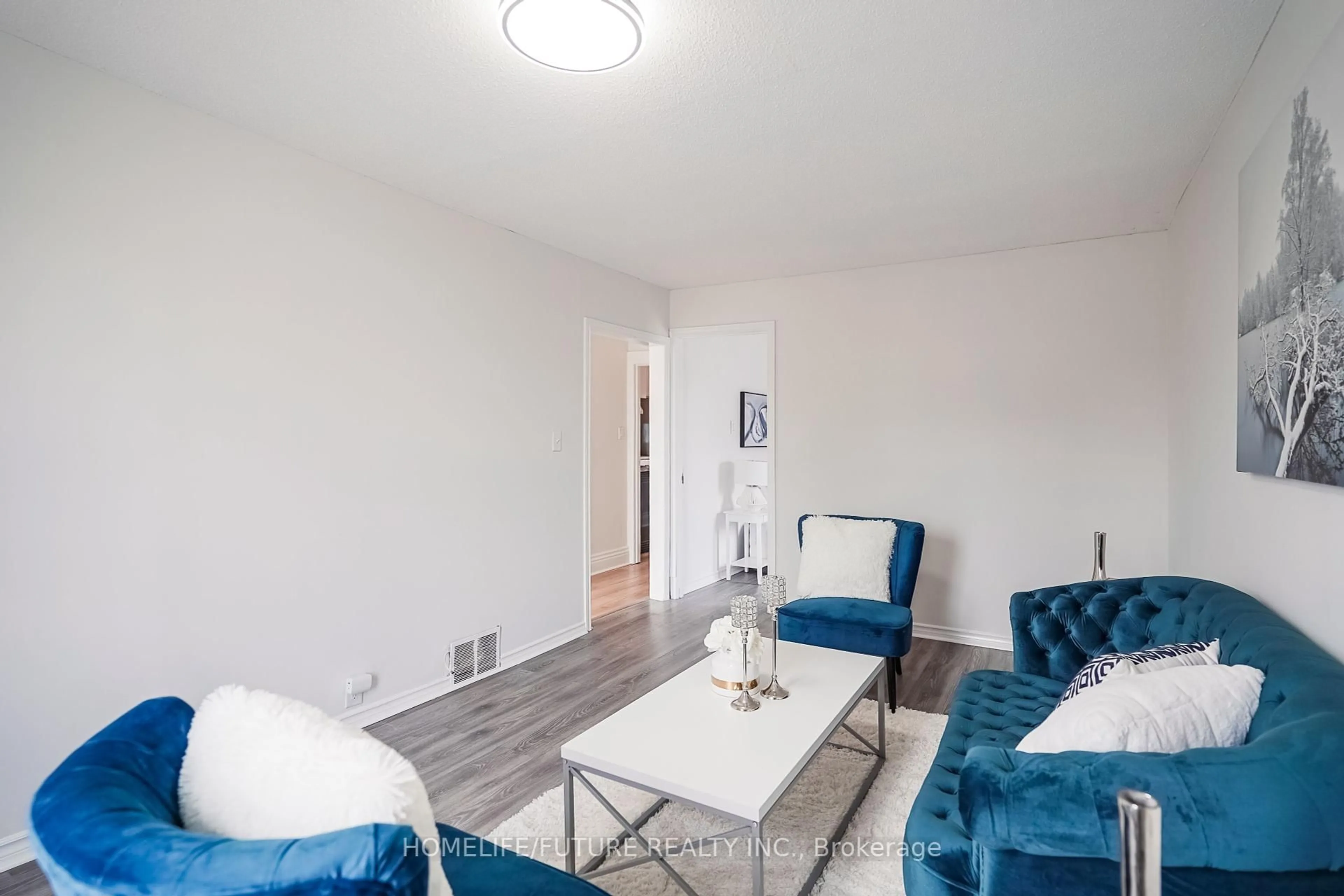 Living room with furniture, wood/laminate floor for 42 Ritson Rd, Oshawa Ontario L1H 5G9