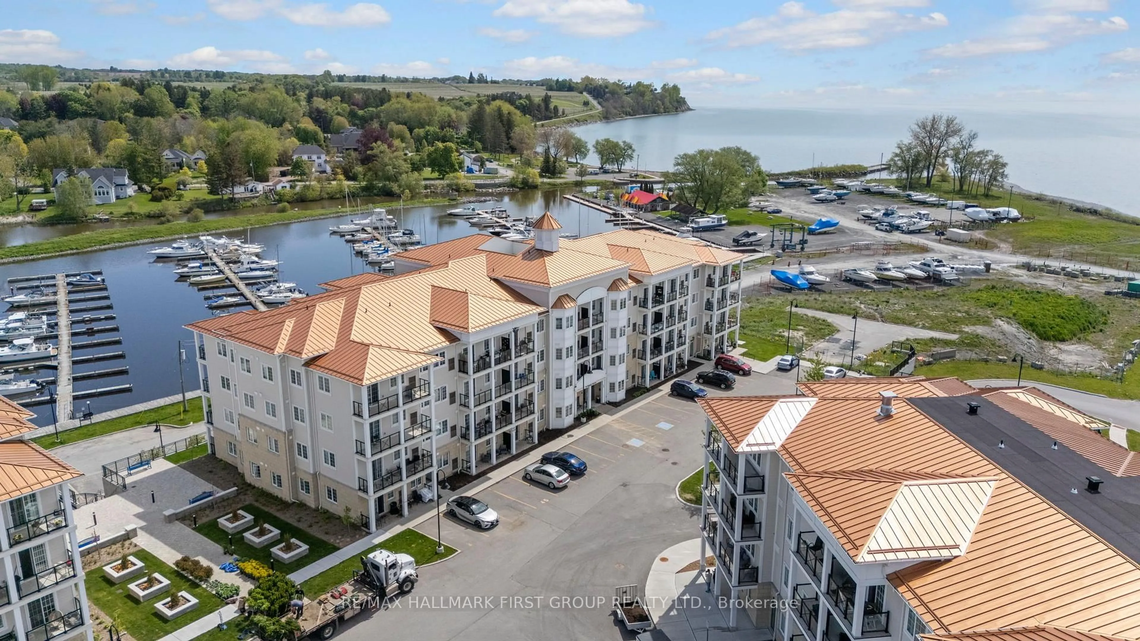 A pic from outside/outdoor area/front of a property/back of a property/a pic from drone, water/lake/river/ocean view for 70 Shipway Ave #201, Clarington Ontario L1B 0V7