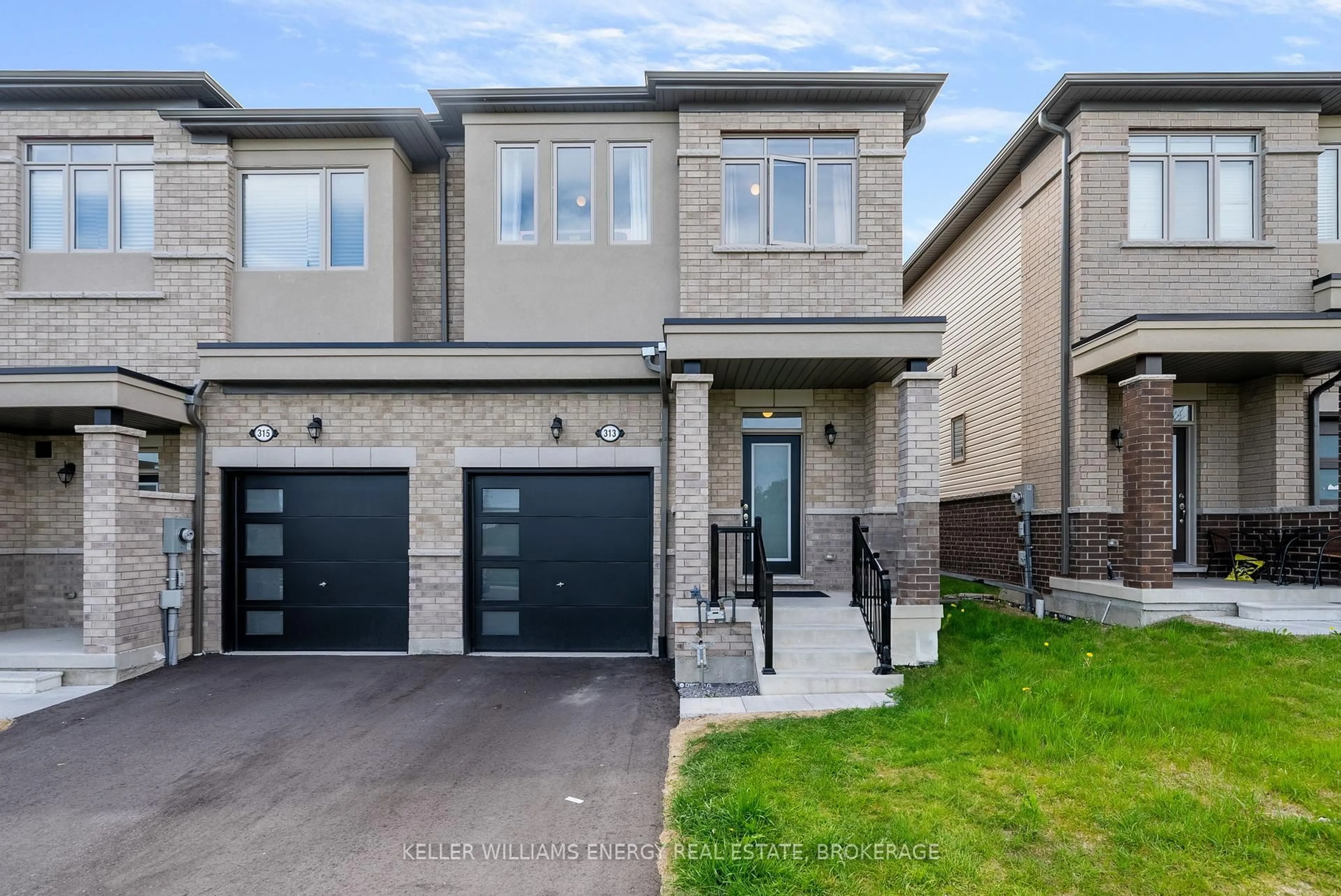 Home with brick exterior material, street for 313 Windfields Farm Dr, Oshawa Ontario L1L 0M2