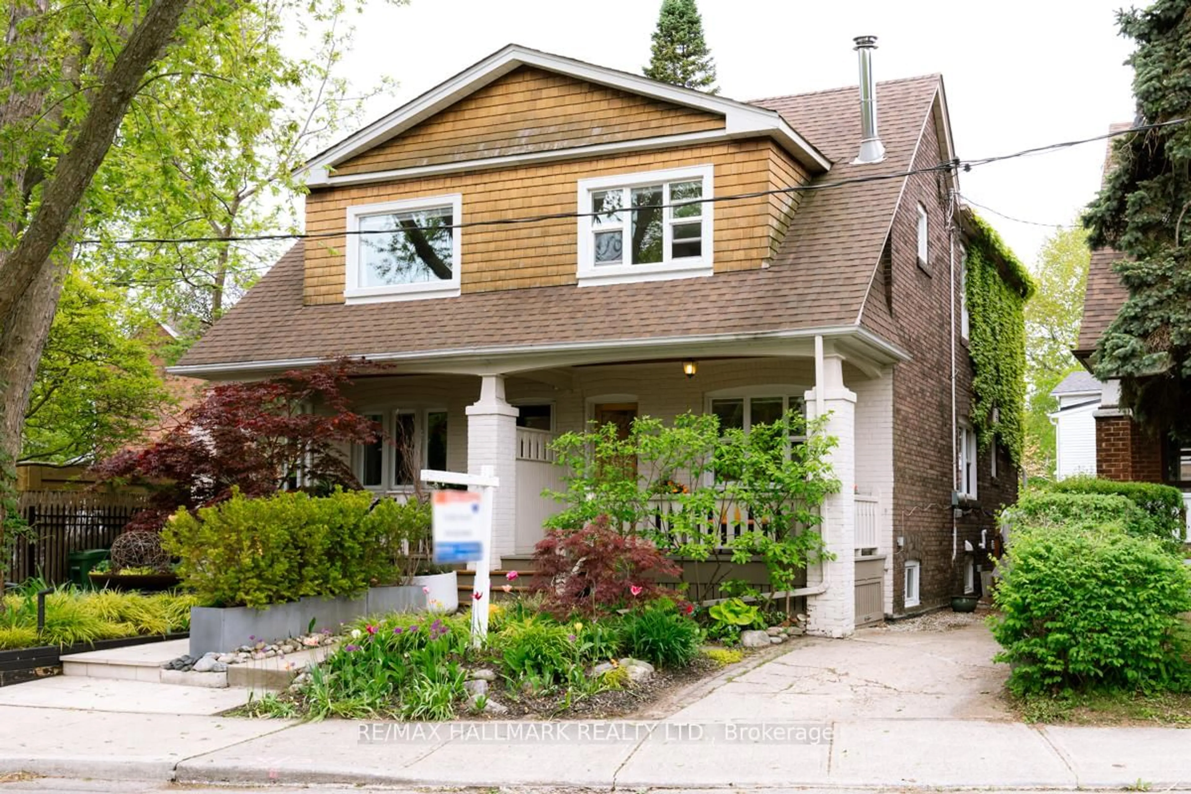 Home with brick exterior material, street for 56 Maughan Cres, Toronto Ontario M4L 3E6