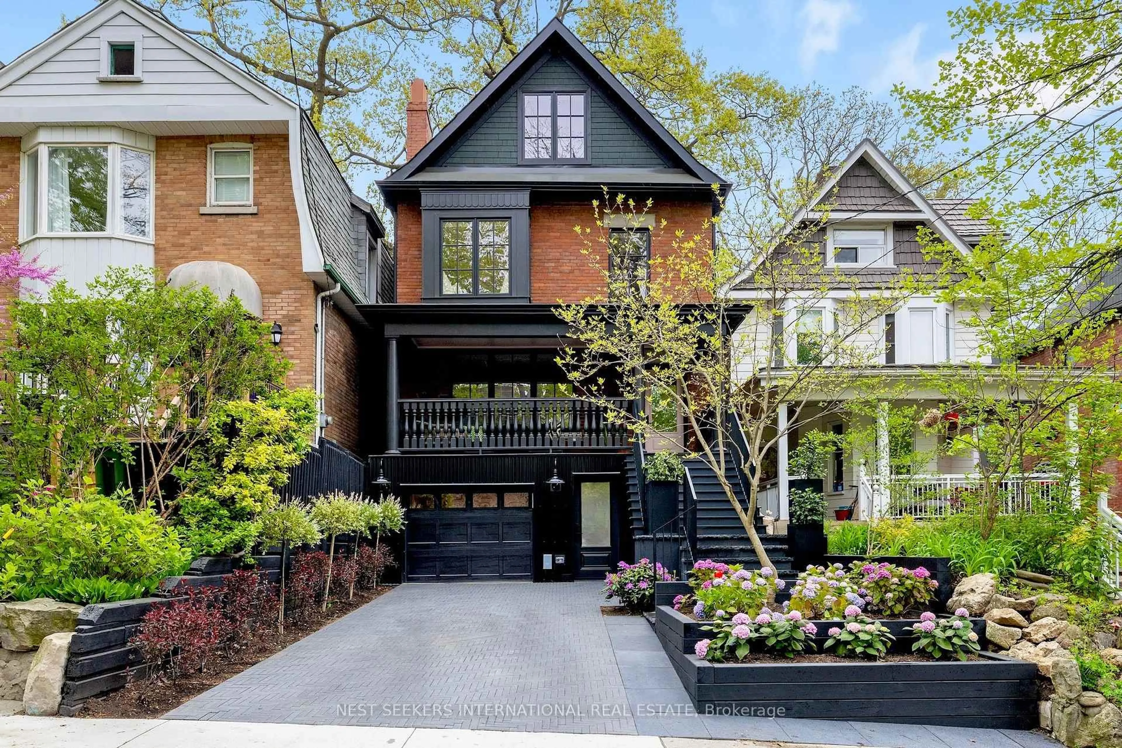 Home with brick exterior material, street for 203 Willow Ave, Toronto Ontario M4E 3K4